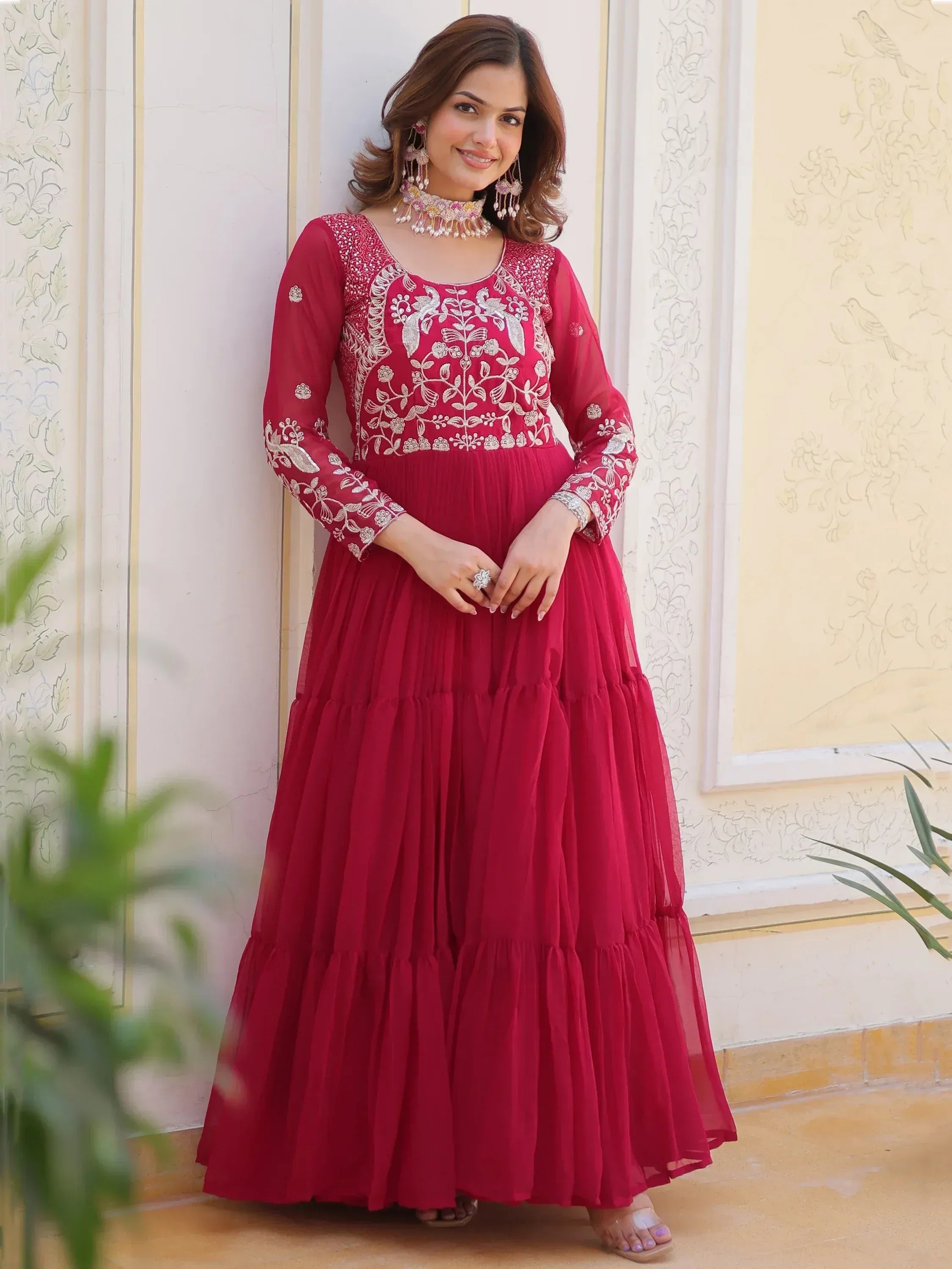 Red embroidered ethnic gown with floral zari work, perfect for Indian festive occasions