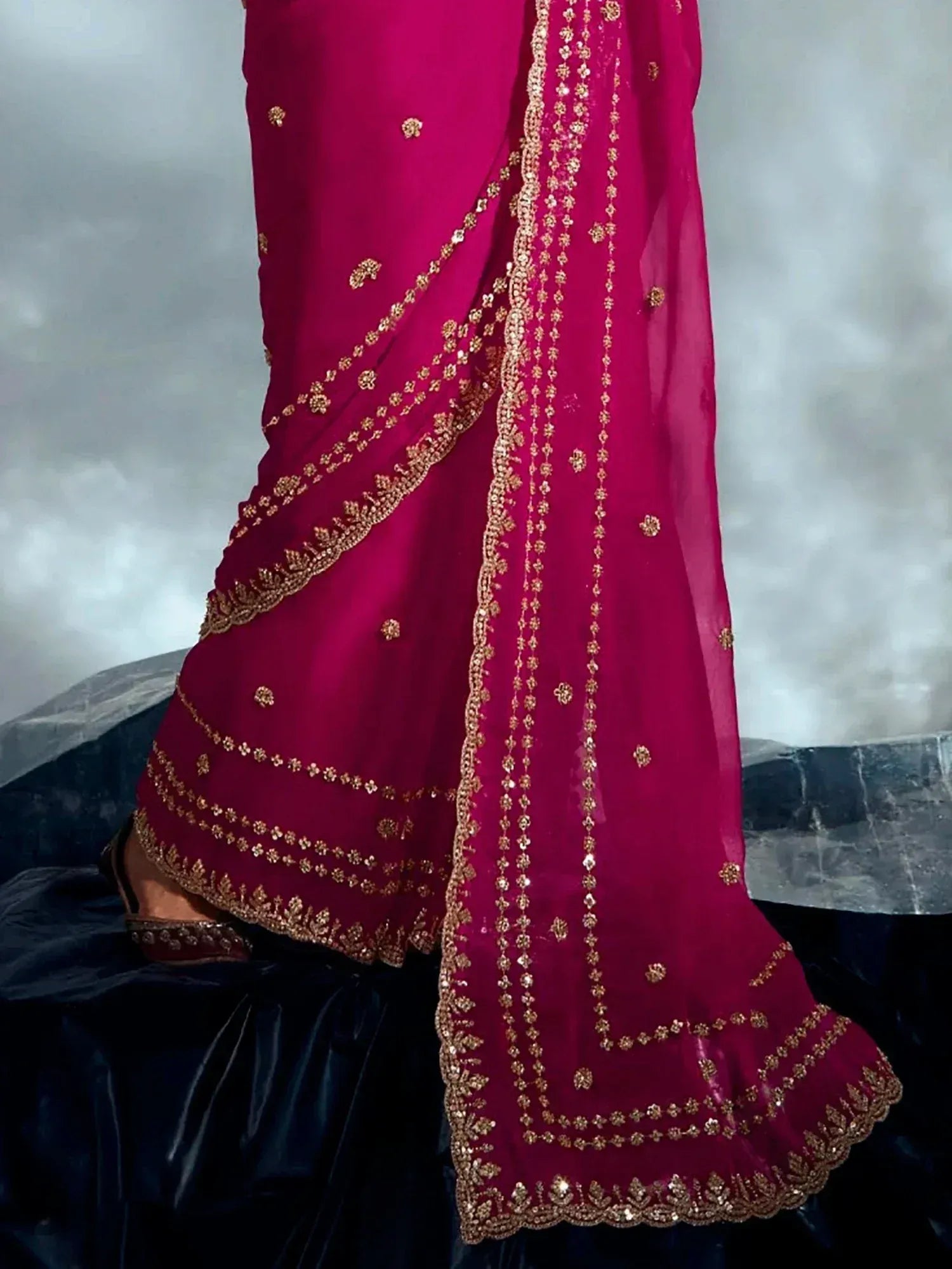 Fuchsia Indian ethnic wear with gold embroidery, perfect for festive occasions and weddings.