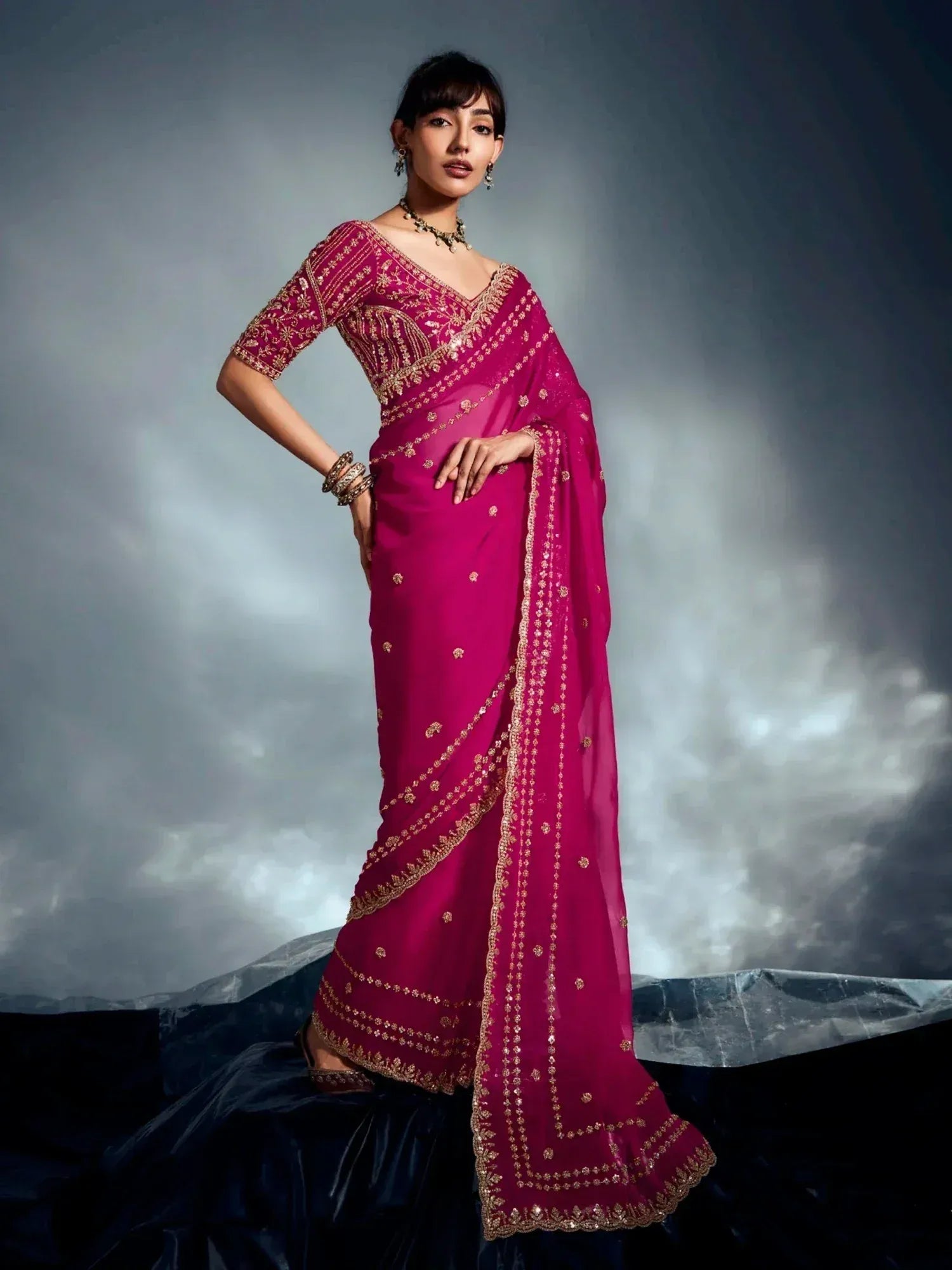 Fuchsia pink designer saree with gold embroidery, perfect for Indian ethnic wear occasions