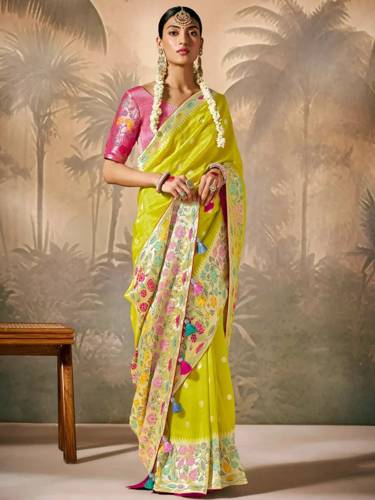 Vibrant yellow floral saree with pink blouse, perfect for Indian ethnic occasions and weddings.
