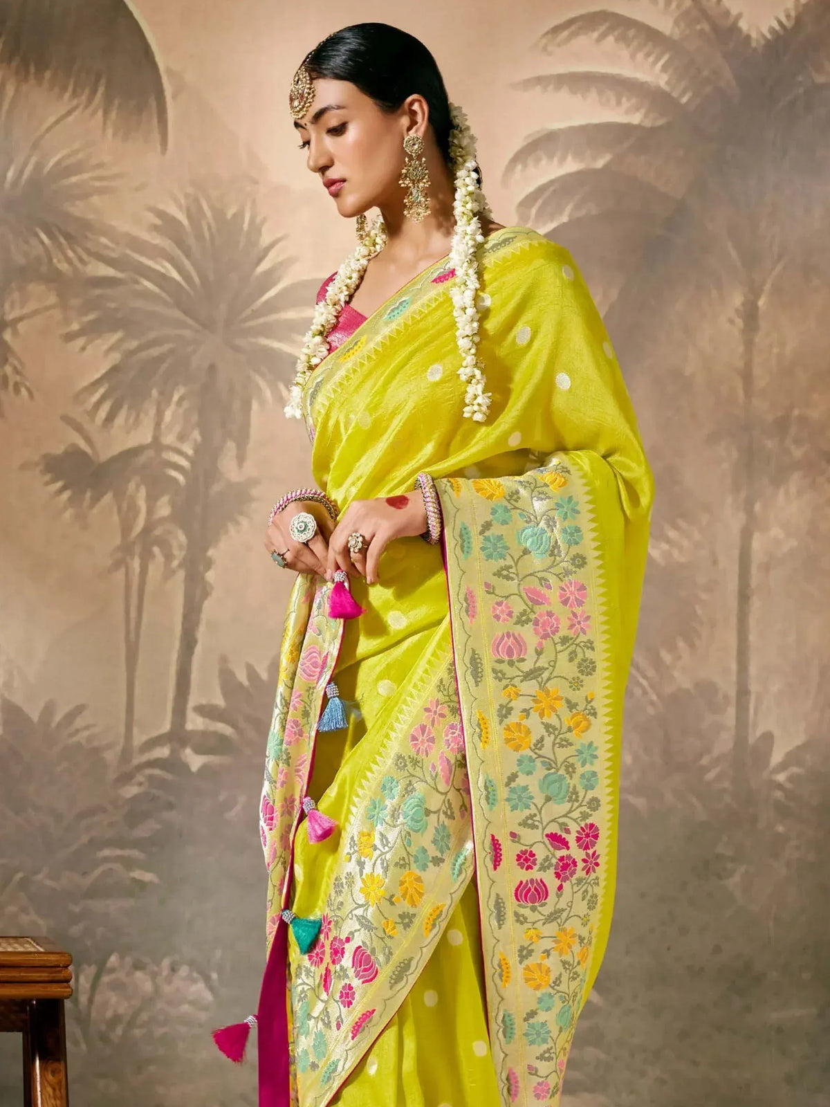 Vibrant yellow floral saree with pink blouse, perfect for Indian ethnic wear and festive occasions.