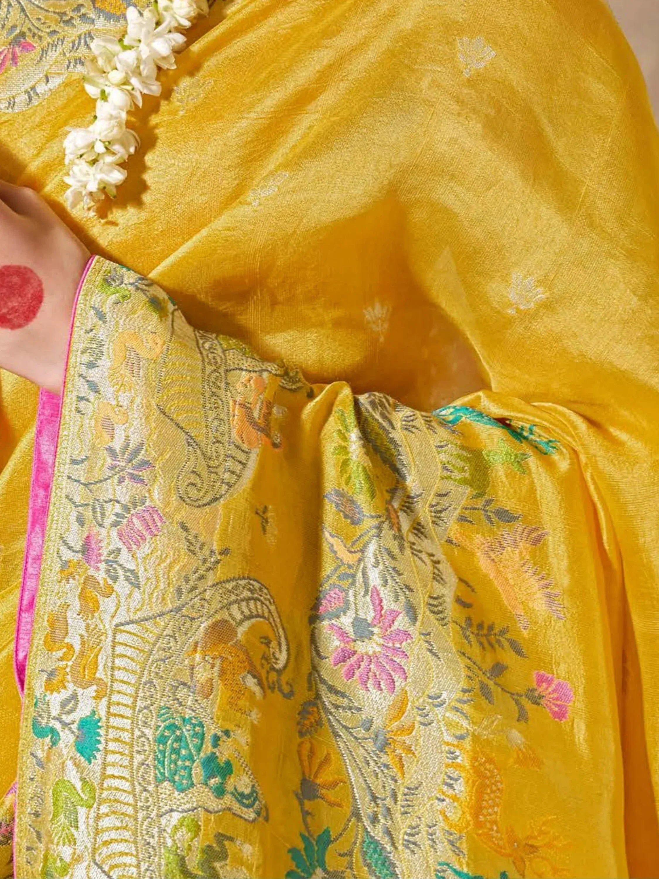 Yellow floral embroidered saree with pink border and jasmine garland, Indian ethnic wear