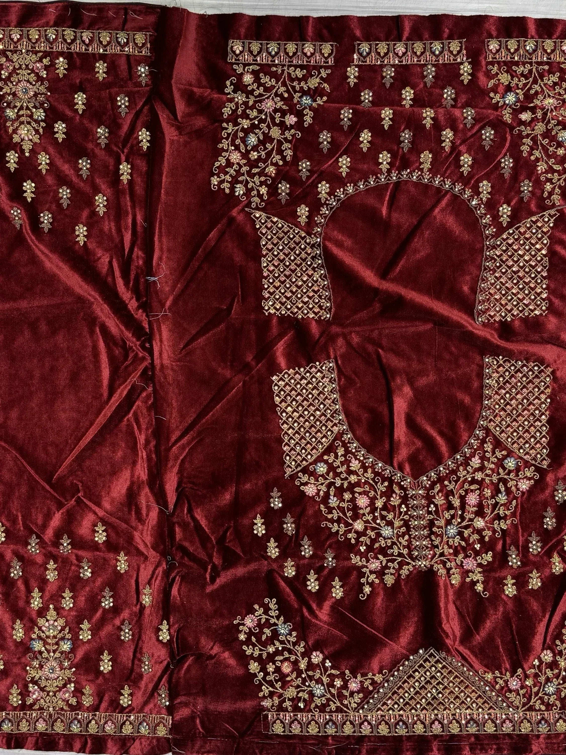 Maroon velvet ethnic wear with gold floral embroidery and beadwork, perfect for designer lehenga or saree
