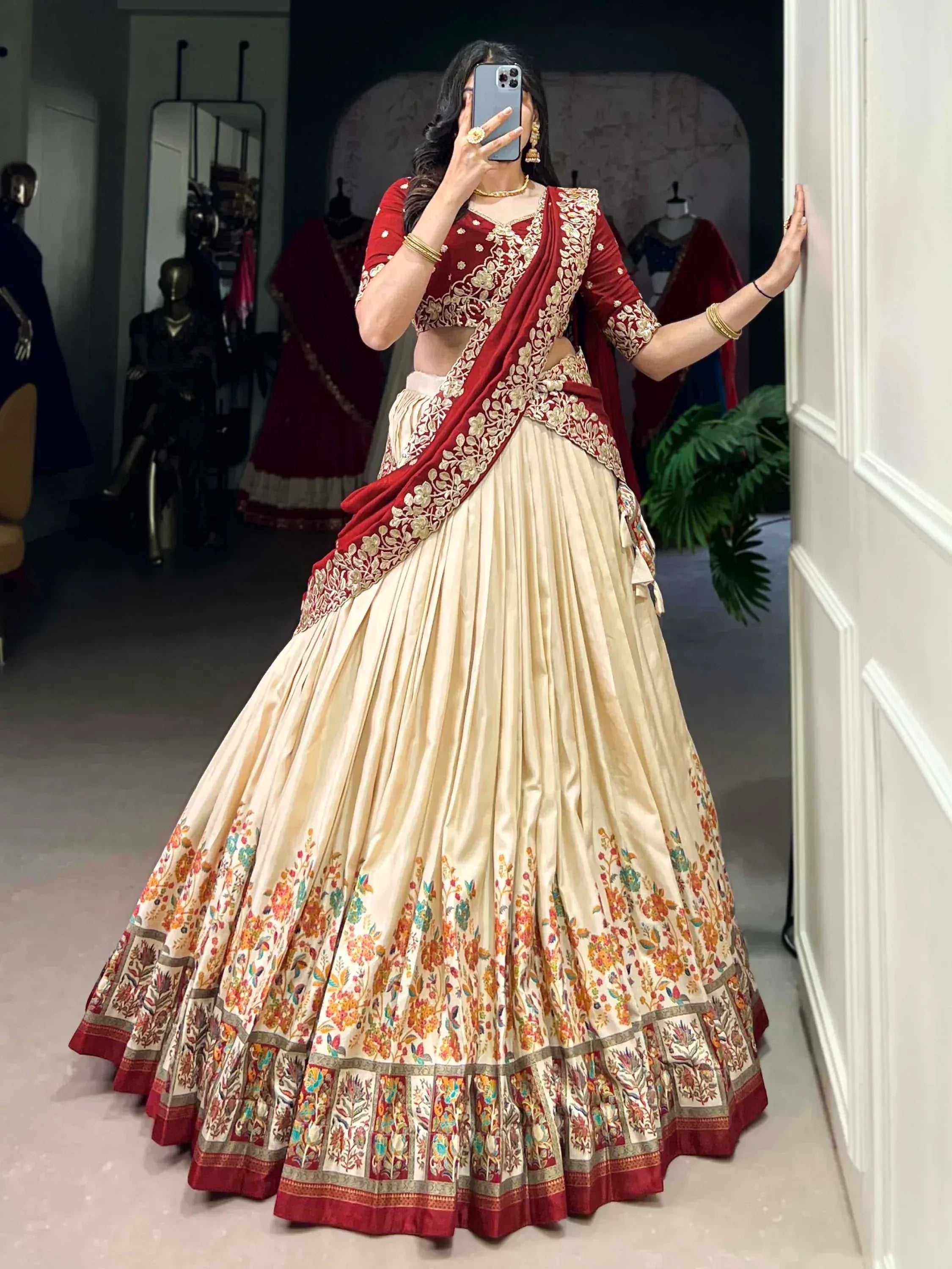 Red and cream embroidered lehenga choli with floral border, Indian ethnic wear for weddings