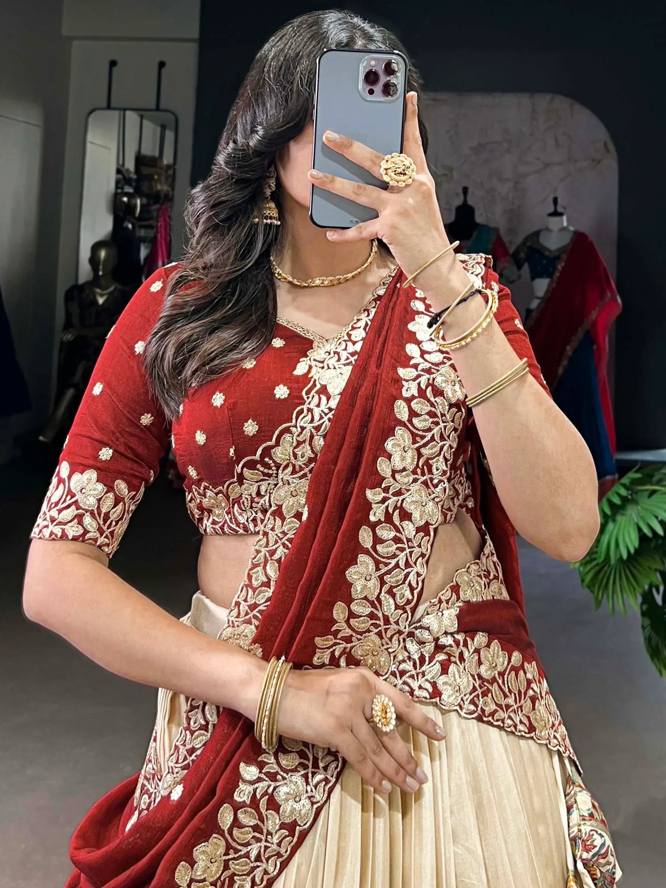 Red and gold embroidered lehenga choli with floral detailing, perfect for Indian ethnic wear occasions.