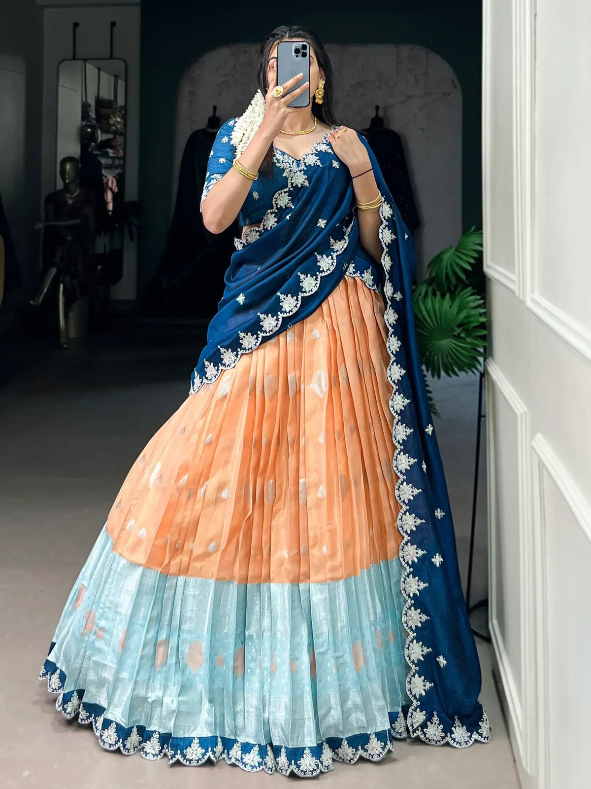 Blue and peach designer lehenga choli with white floral embroidery, perfect for Indian ethnic wear occasions