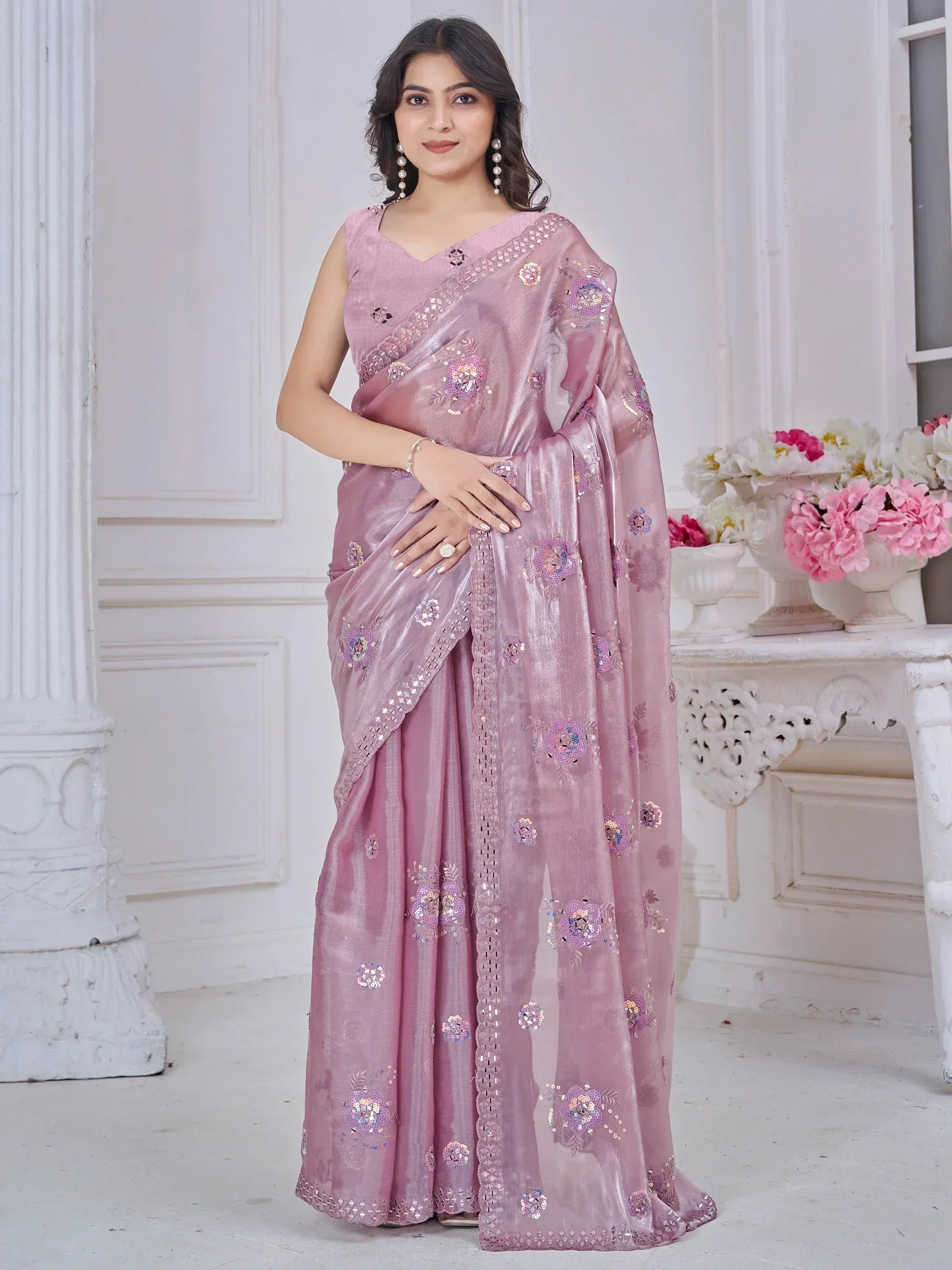 Elegant pink saree with floral sequin embroidery, perfect for Indian ethnic occasions and festive wear.