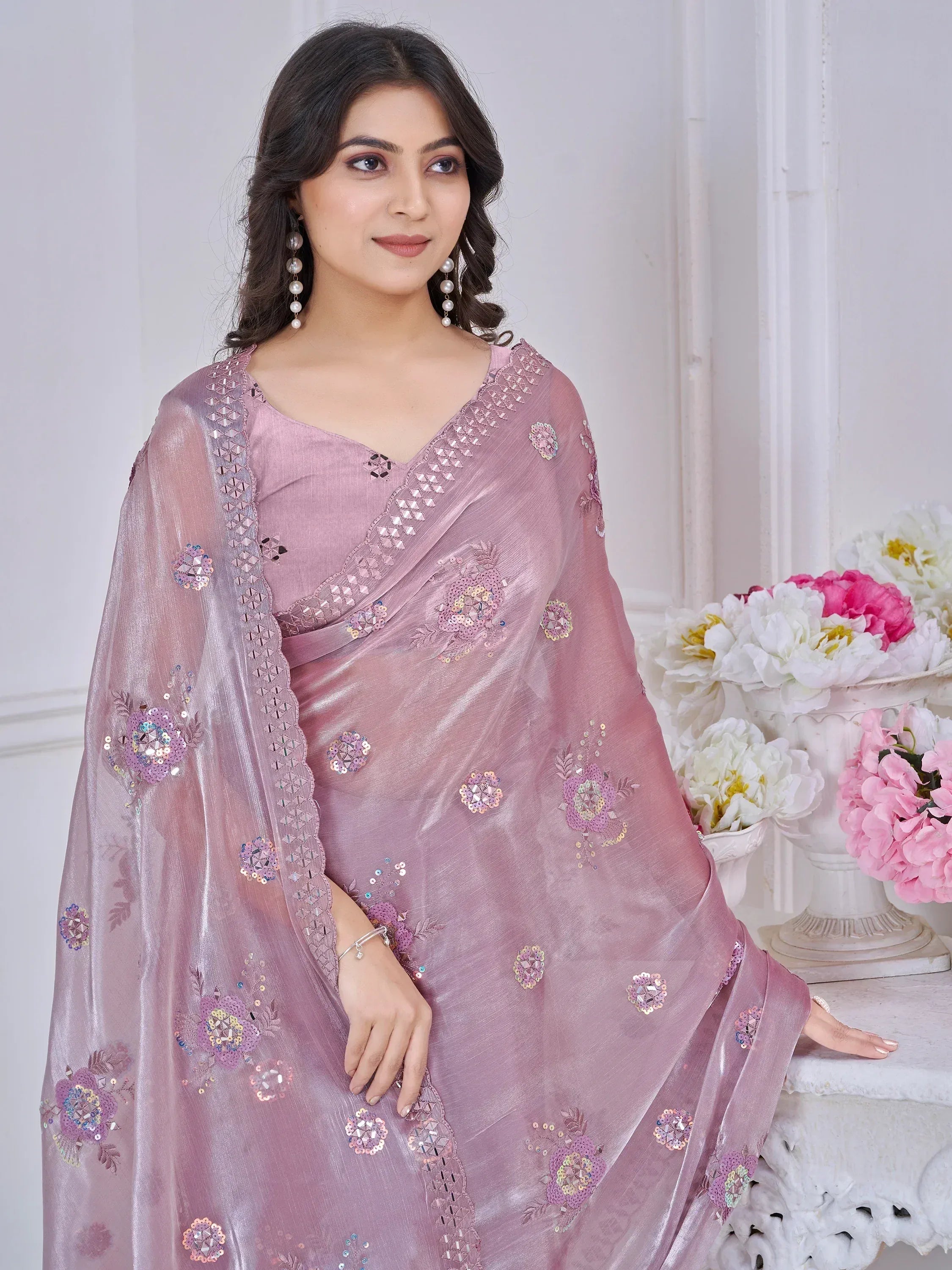 Elegant pink saree with floral sequin embroidery, perfect for Indian ethnic occasions
