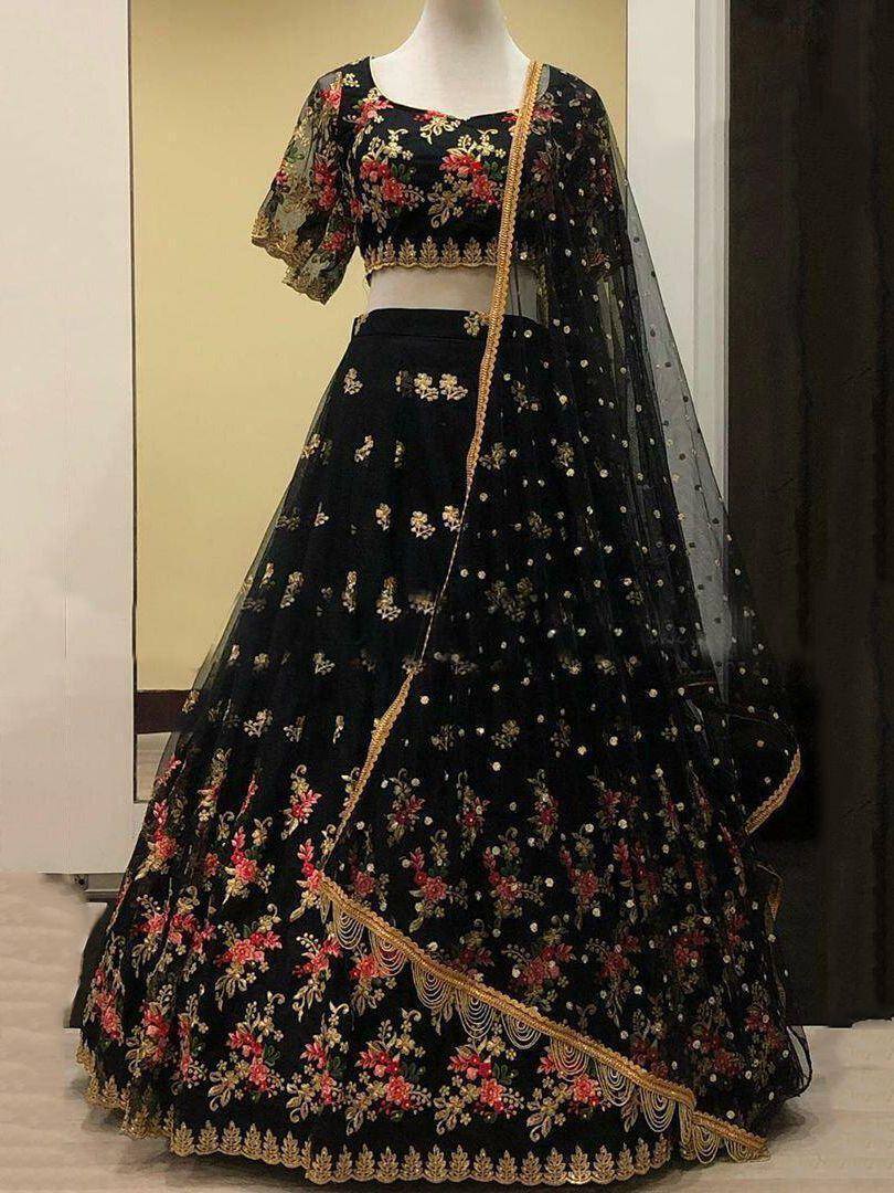 Black floral embroidered lehenga choli with gold detailing and sheer dupatta, perfect for Indian ethnic occasions.