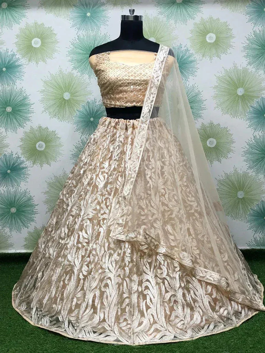 Elegant gold embroidered lehenga choli with sheer dupatta, perfect for Indian weddings and festive occasions