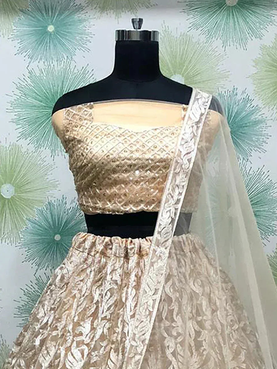 Gold embroidered lehenga choli with sheer dupatta, designer Indian ethnic wear for weddings