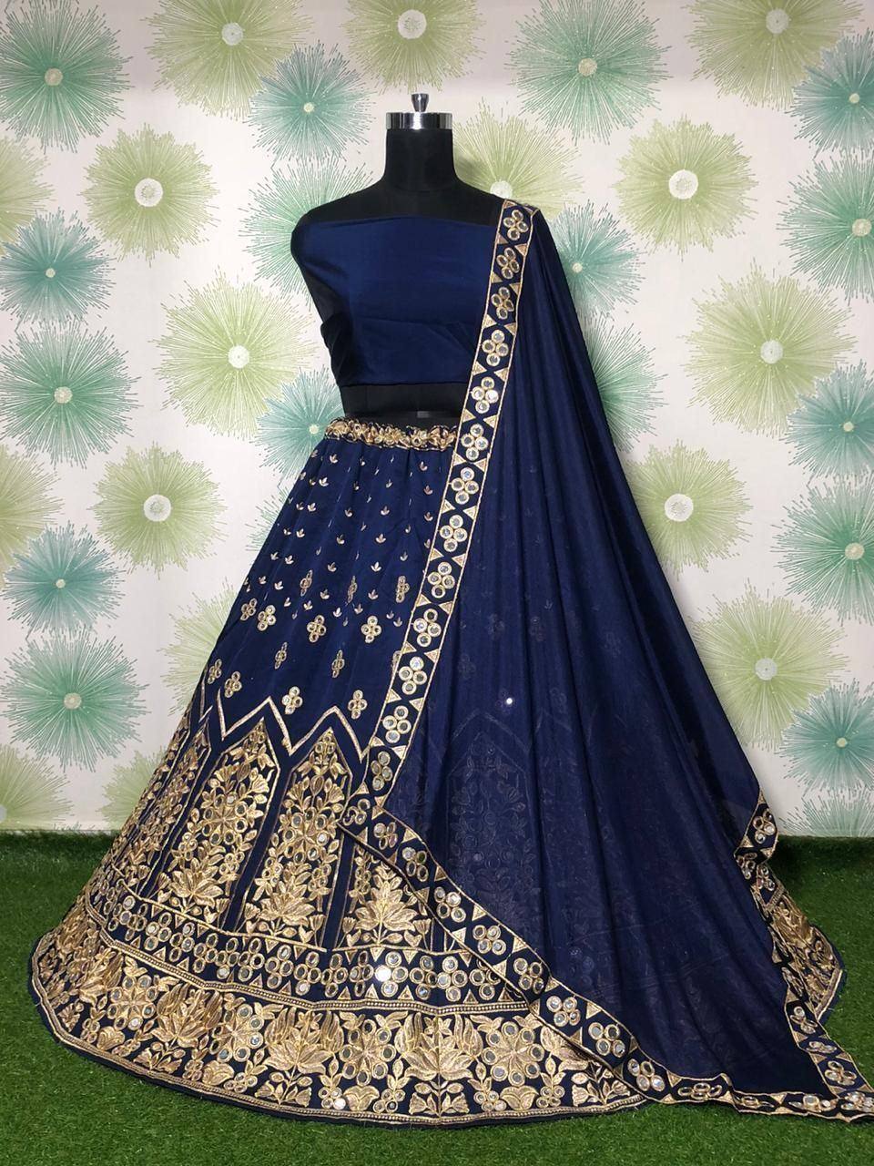 Navy blue designer lehenga choli with gold embroidery and mirror work, perfect for Indian ethnic wear