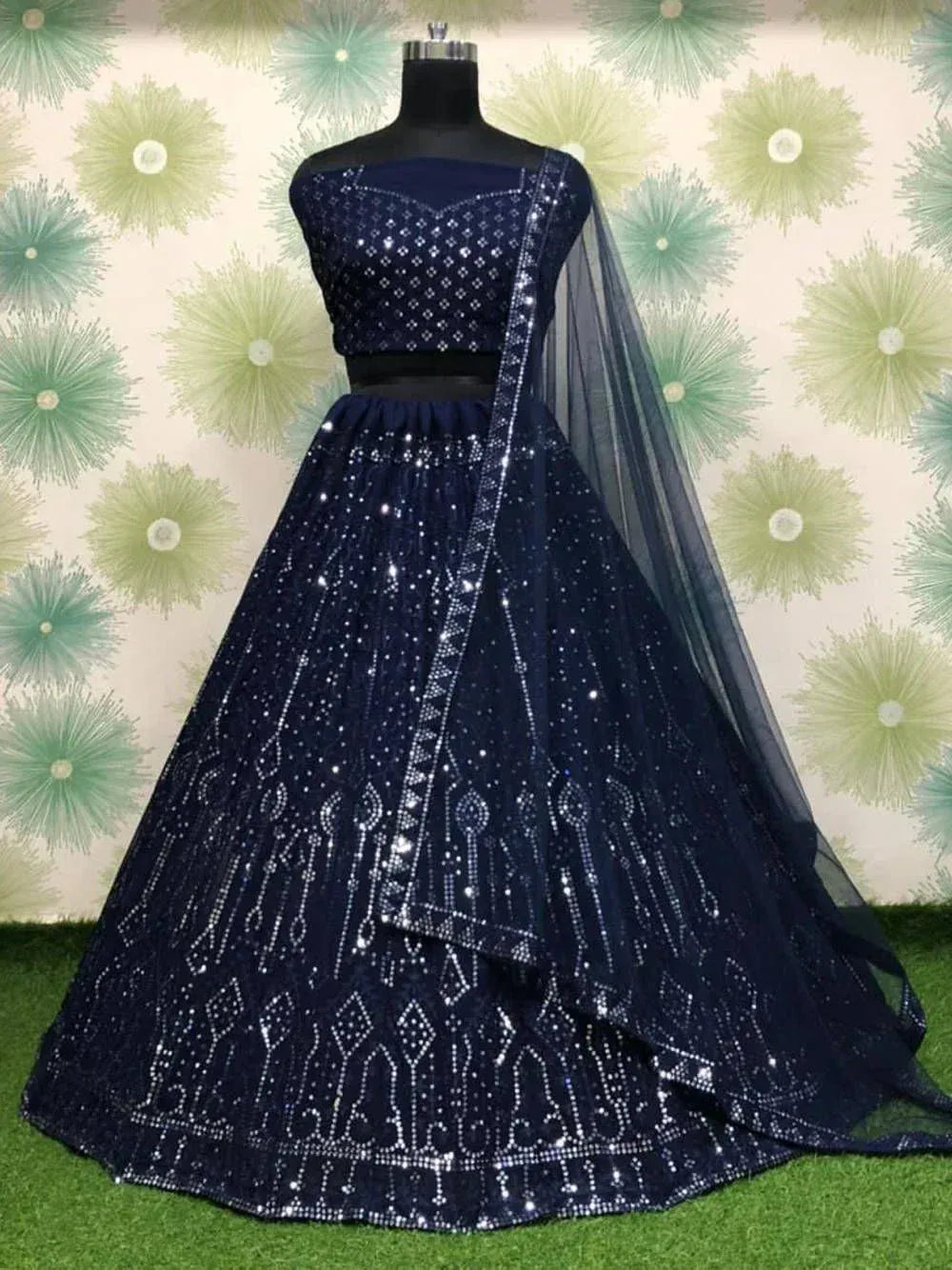 Navy blue designer lehenga choli with heavy sequin work and sheer dupatta, perfect for Indian weddings and festive occasions.