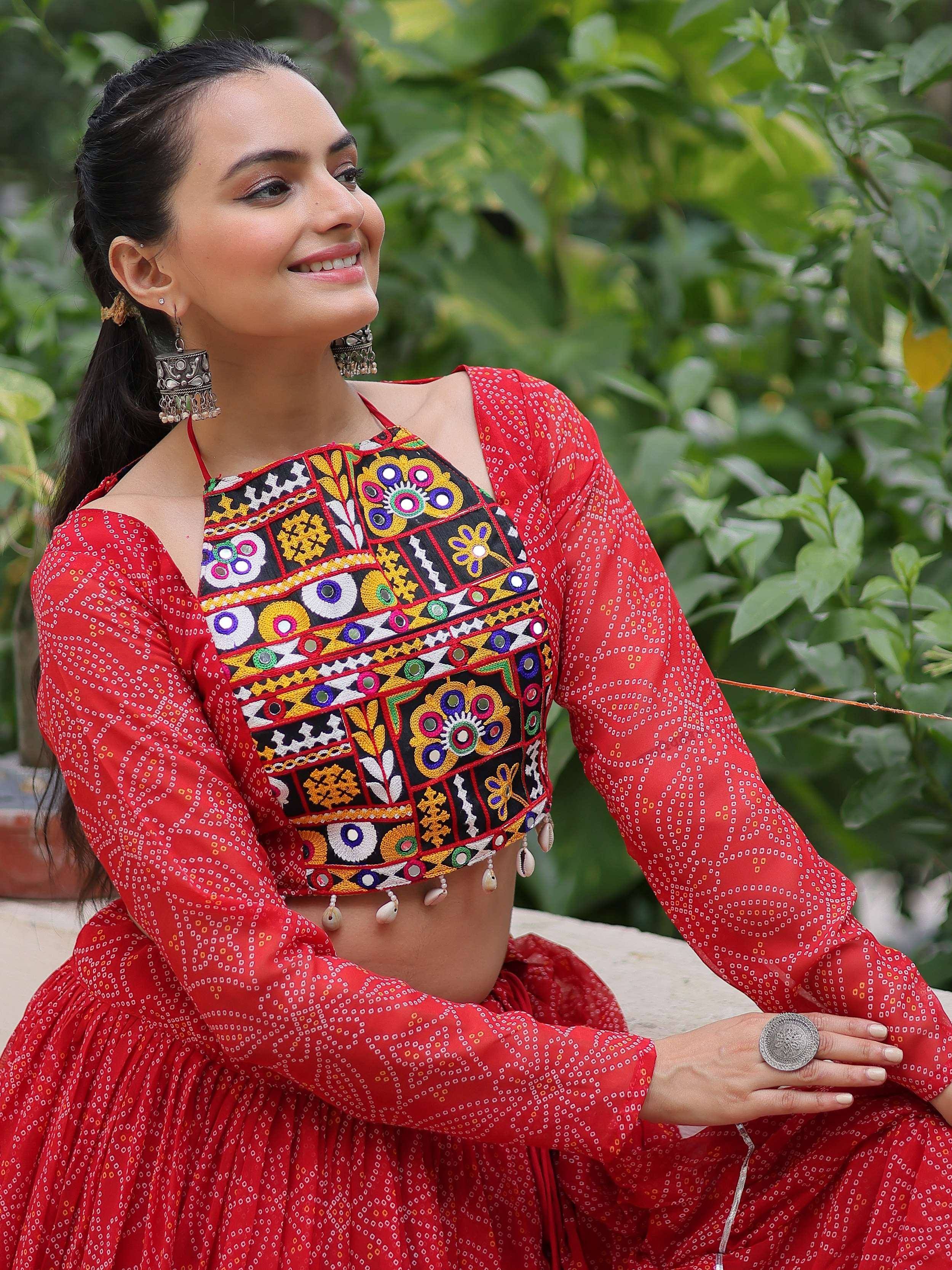 Red ethnic crop top with mirror work and embroidery, paired with matching skirt, traditional Indian wear