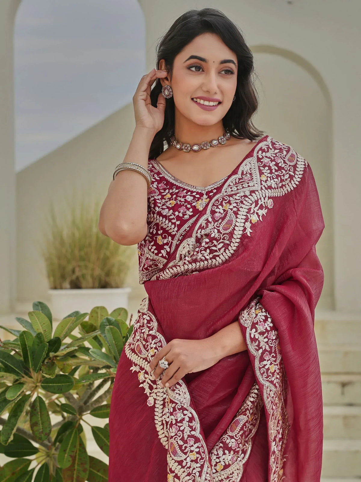 Elegant maroon saree with floral embroidery, perfect for Indian ethnic wear occasions