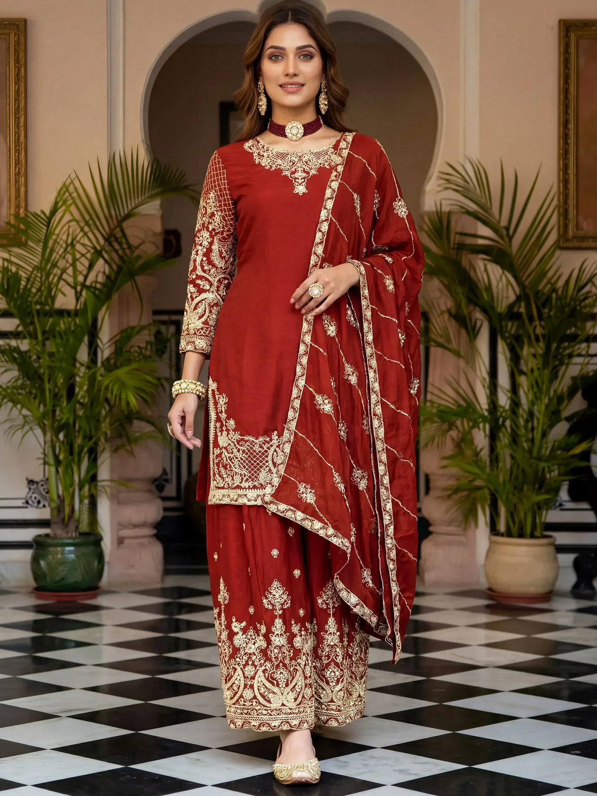 Elegant maroon salwar kameez with gold embroidery, perfect for Indian ethnic wear occasions.