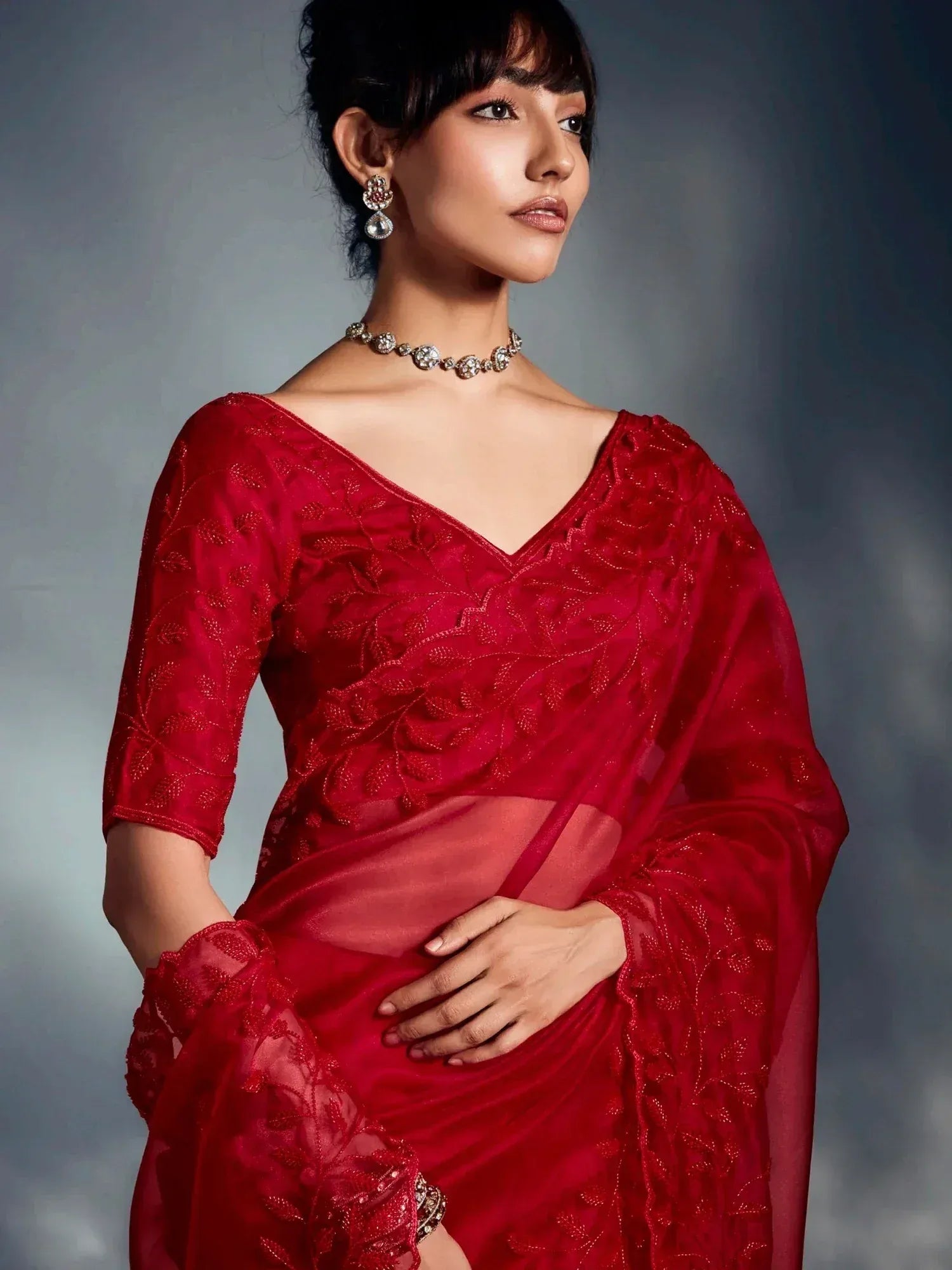 Red embroidered saree with designer blouse, perfect for Indian ethnic wear occasions