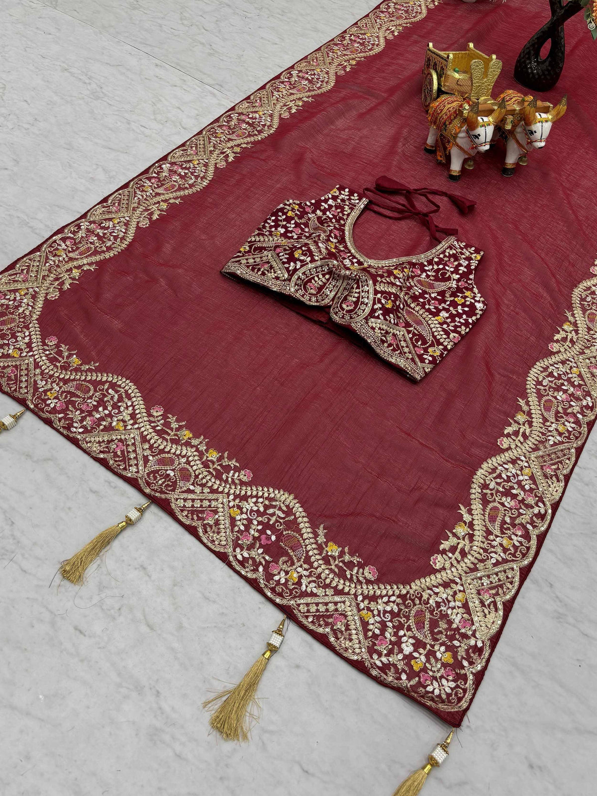 Maroon embroidered lehenga choli with gold floral border and tassels, Indian ethnic wear