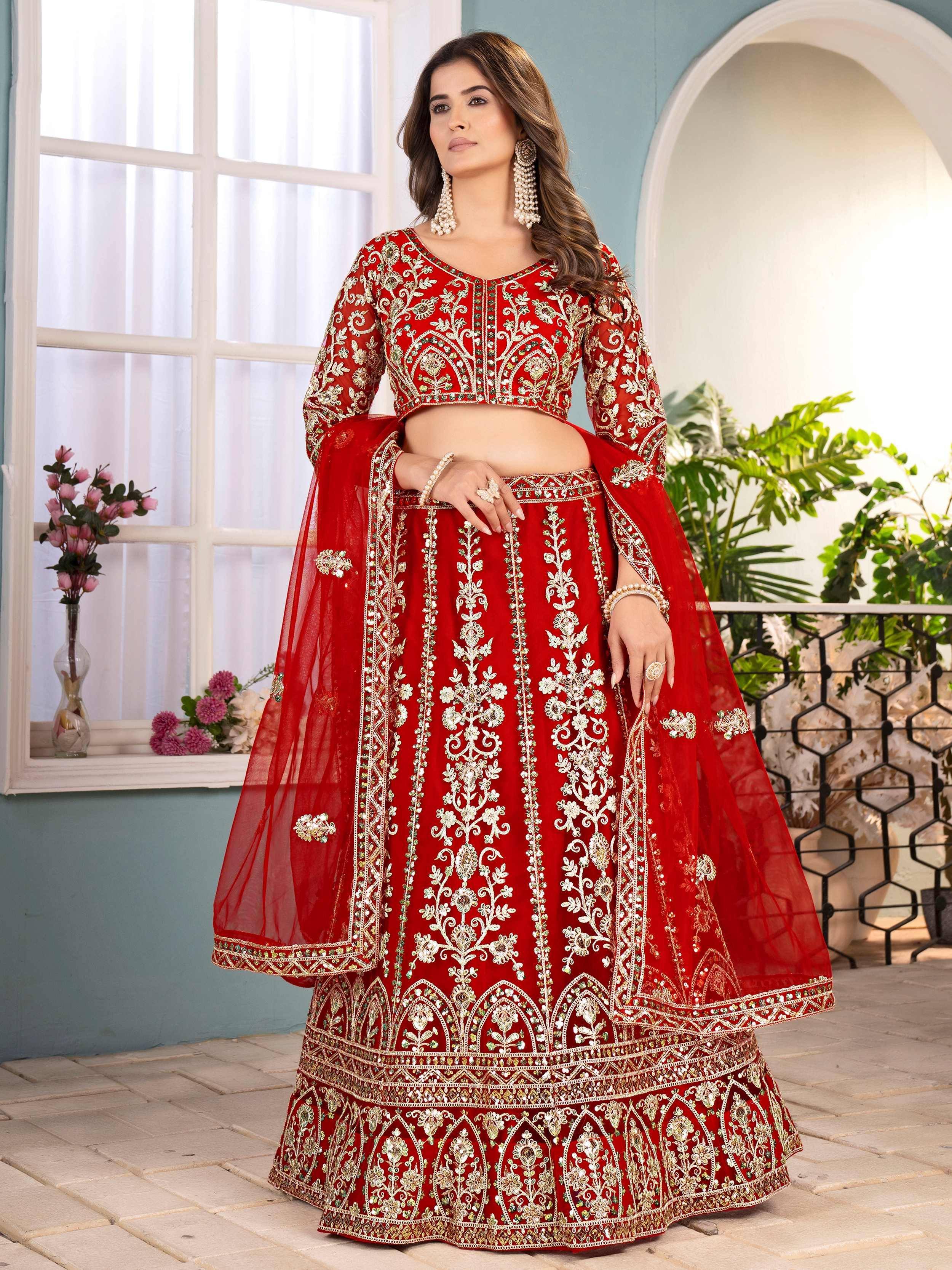 Red embroidered lehenga choli with gold detailing, perfect for Indian weddings and festive occasions