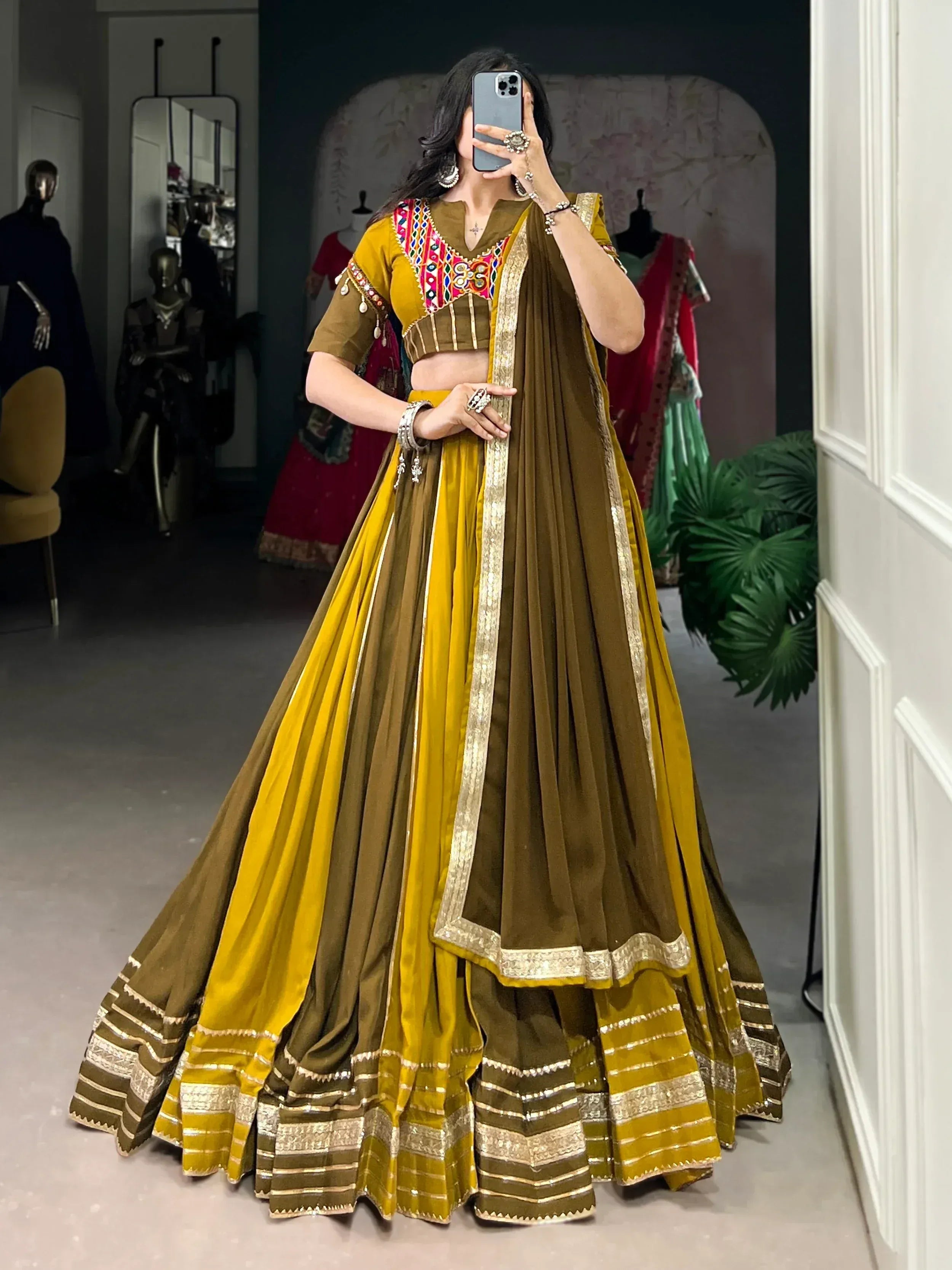 Mustard and olive green designer lehenga choli with mirror work and gold trim, perfect for Indian ethnic wear