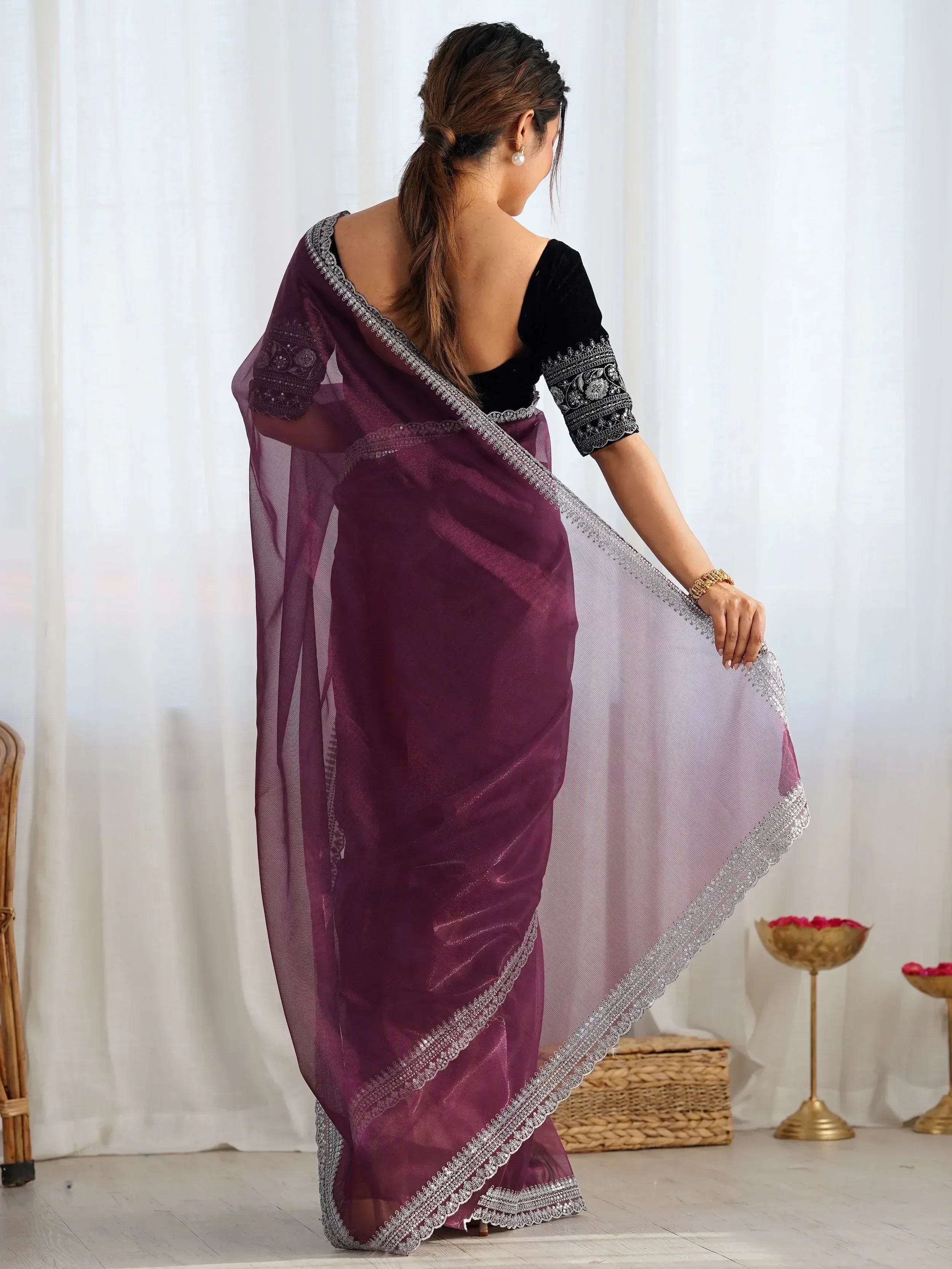 Purple ethnic saree with silver embroidery and black velvet blouse, perfect for Indian occasions