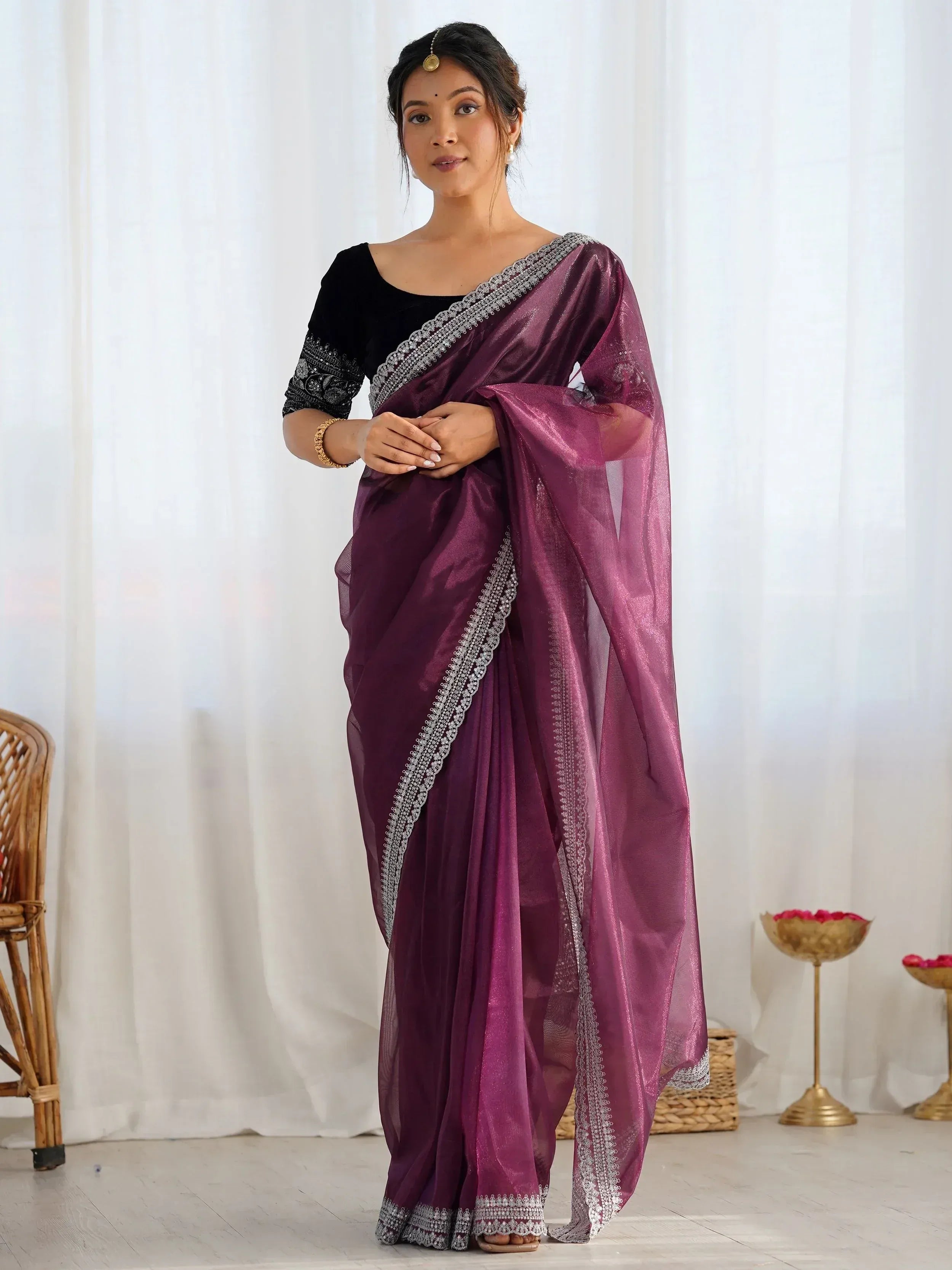 Elegant purple saree with silver embroidery, paired with black velvet blouse, perfect for Indian ethnic occasions.