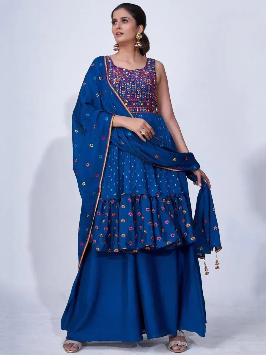 Woman wearing blue embroidered ethnic gown with dupatta, traditional Indian attire