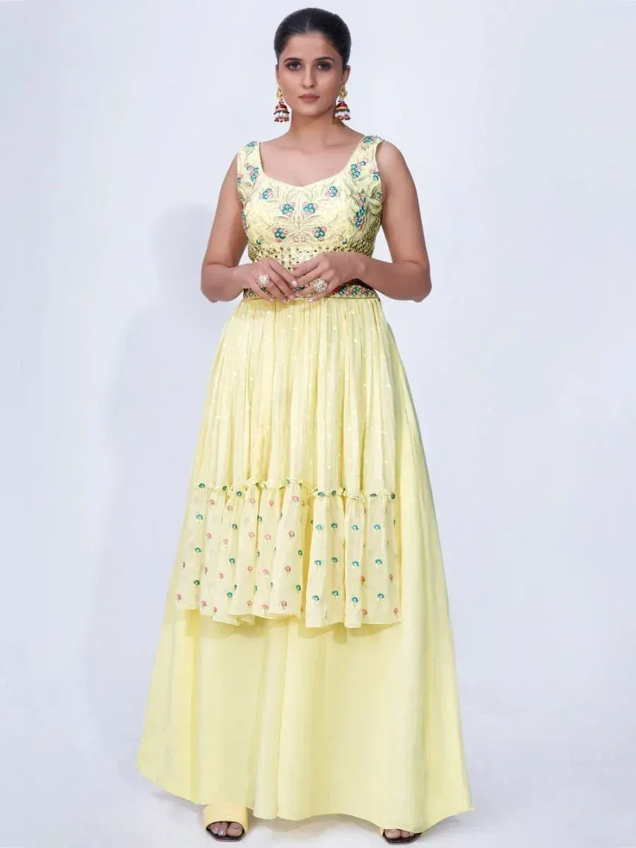 Yellow embroidered ethnic gown with floral detailing, perfect for Indian occasions and festive wear.