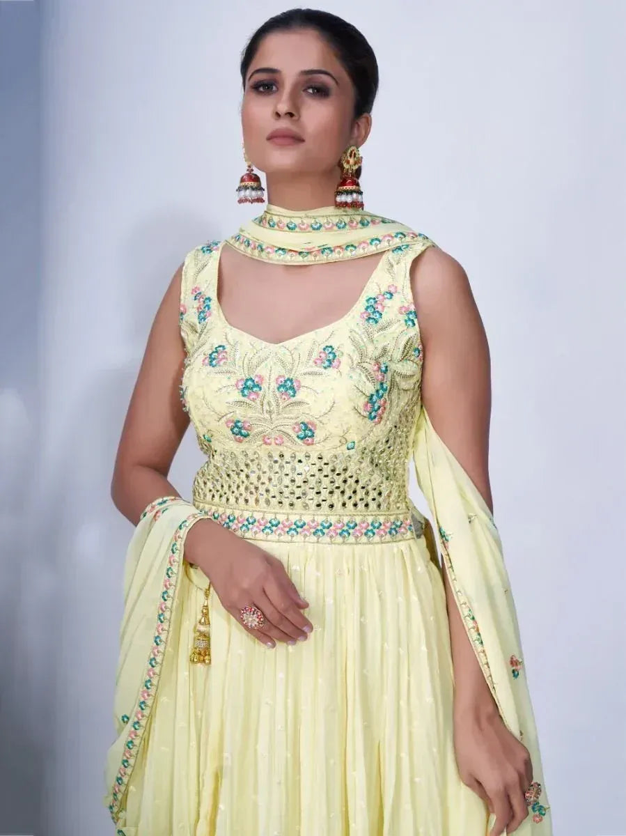 Elegant yellow embroidered anarkali suit with floral detailing and matching dupatta, perfect for Indian ethnic occasions