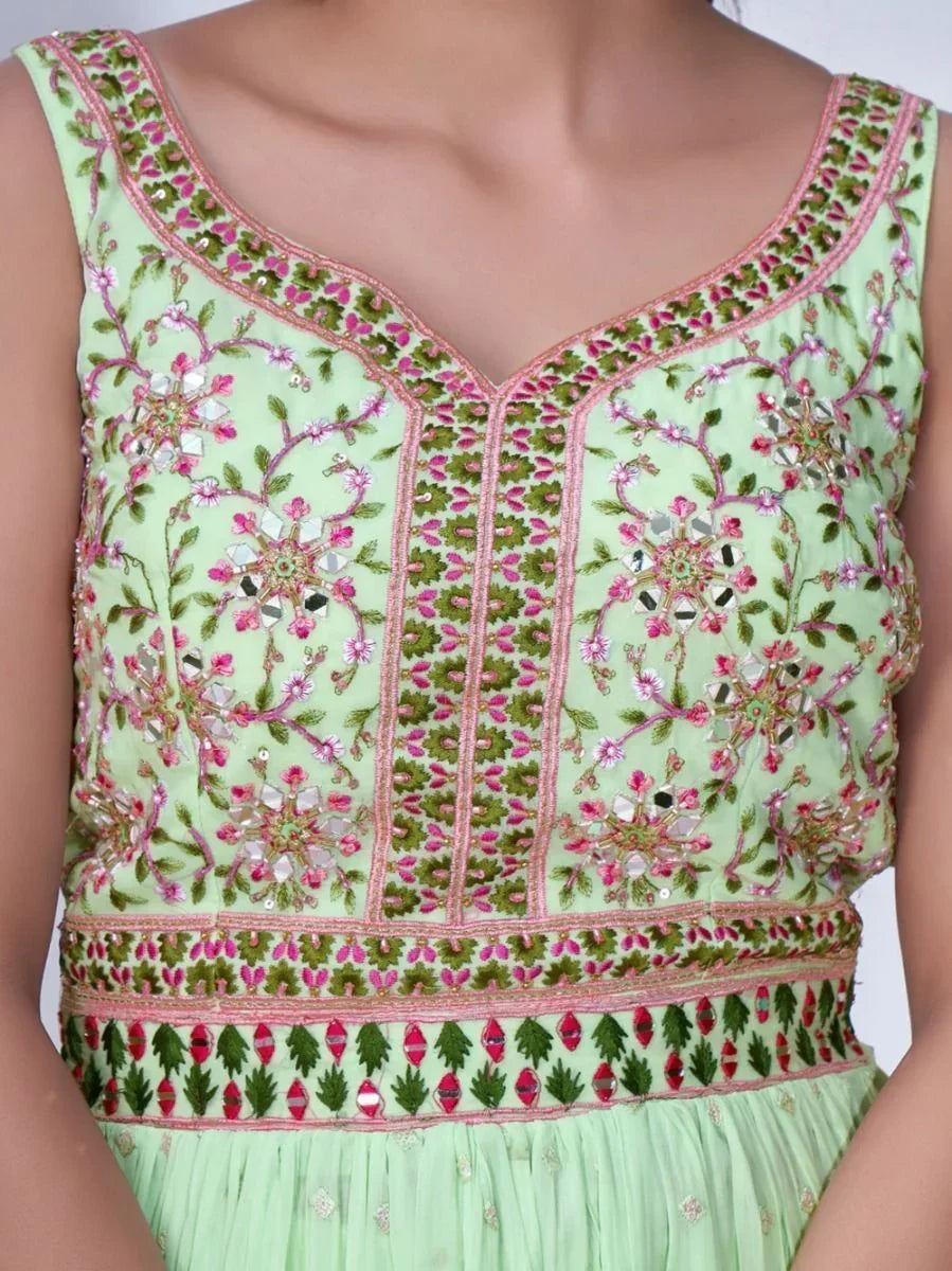 Light green ethnic dress with intricate pink and green floral embroidery and mirror work