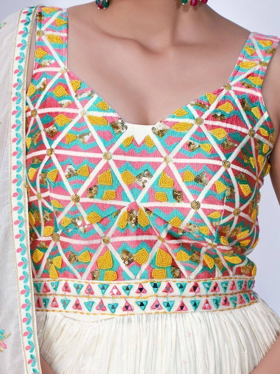 Colorful embroidered lehenga choli blouse with geometric patterns and sequin work