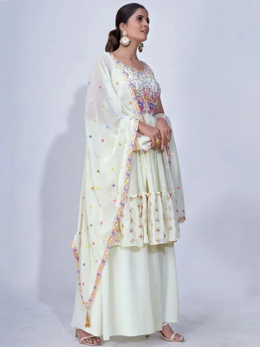 Elegant cream embroidered sharara suit with floral dupatta, perfect for Indian ethnic occasions