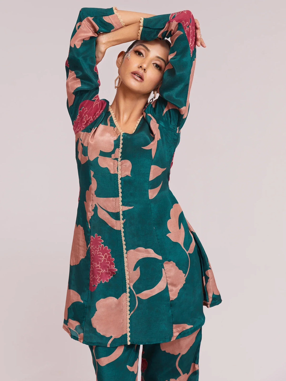 Teal floral print ethnic kurta with lace detailing, styled for Indian wear