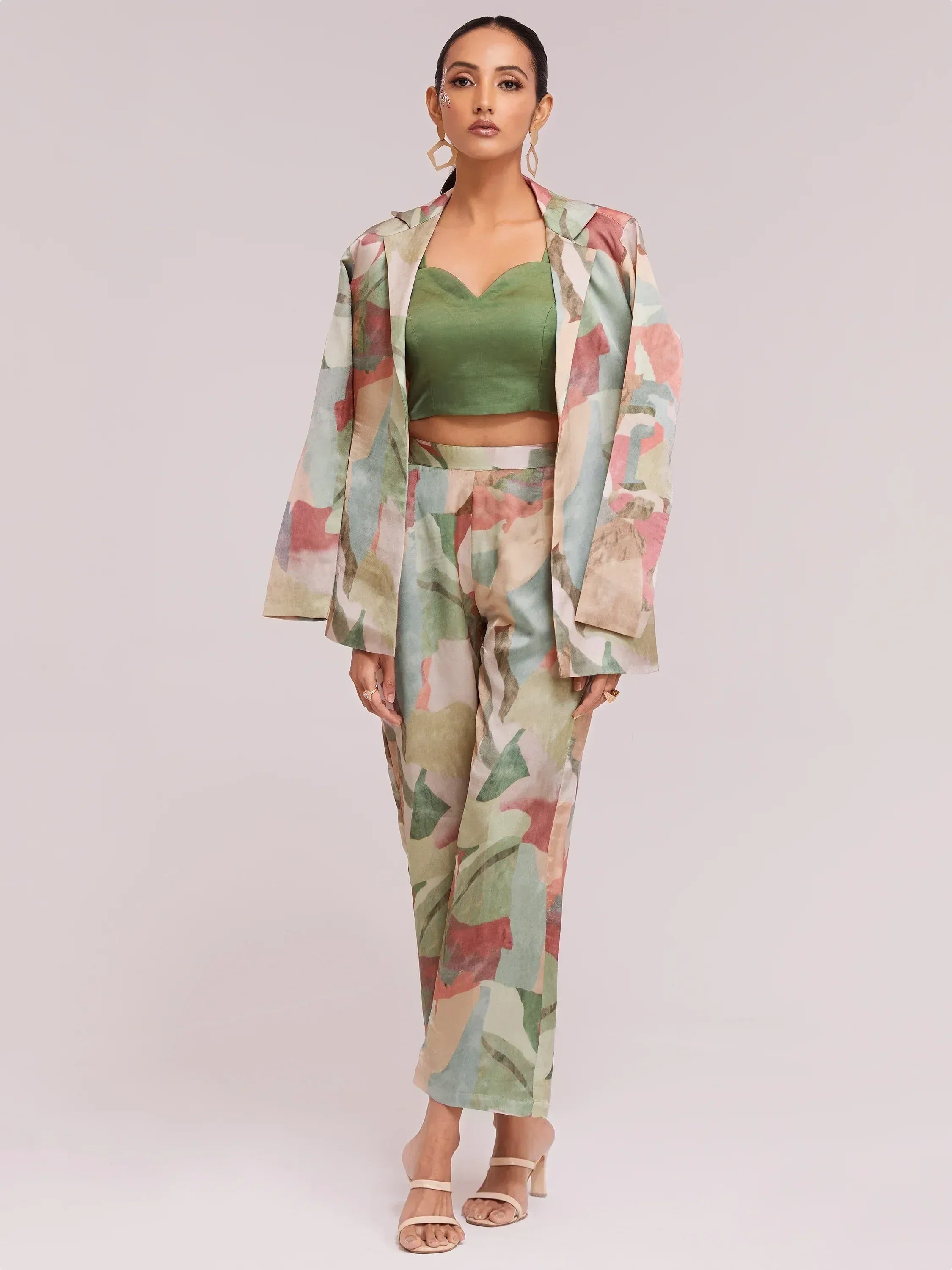 Woman in floral print ethnic pantsuit with green crop top, stylish Indian wear