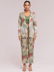 Woman wearing pastel abstract print ethnic suit set with green crop top from Ethnic Plus