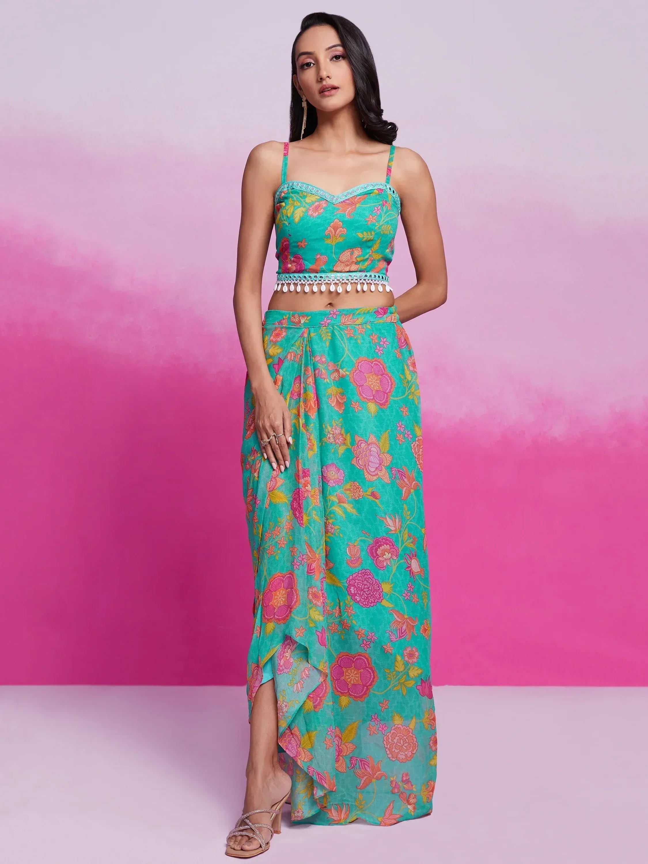Turquoise floral print ethnic gown with spaghetti straps and side slit, perfect for Indian occasions