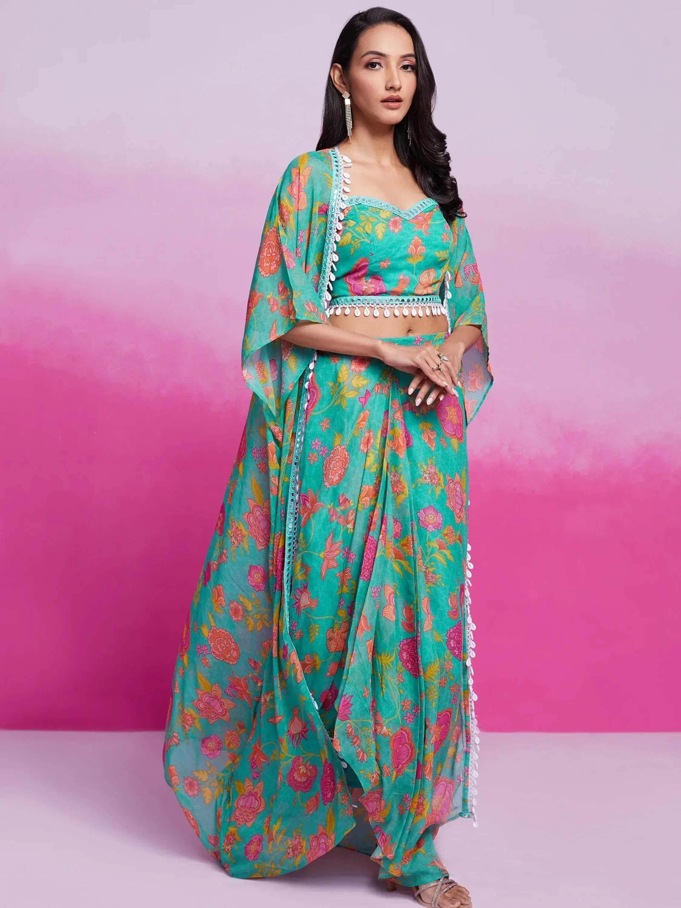 Turquoise floral print lehenga choli with pom-pom trim, Indian ethnic wear for women