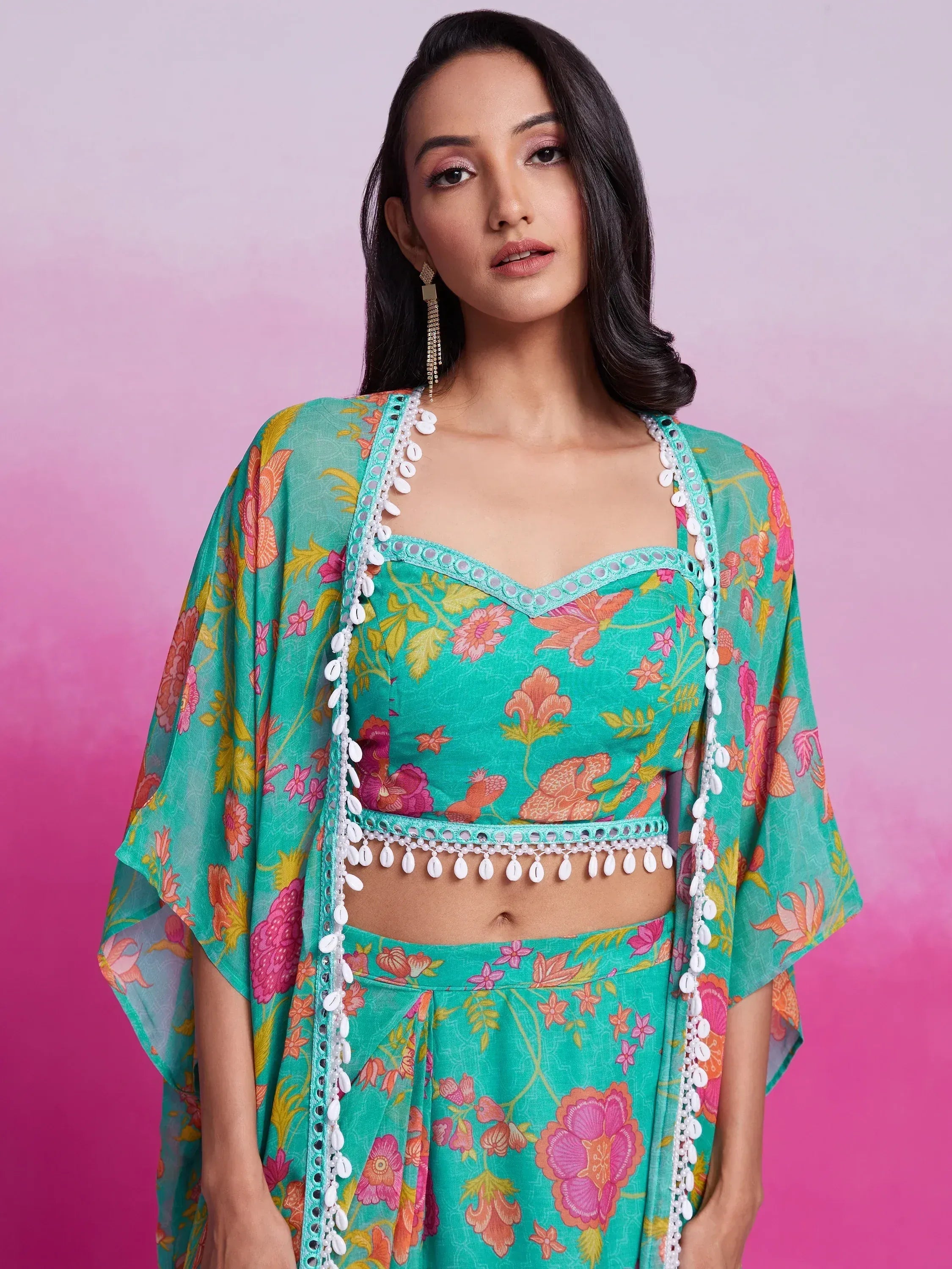 Turquoise floral ethnic crop top with shell trim and matching palazzo pants, perfect for festive occasions.