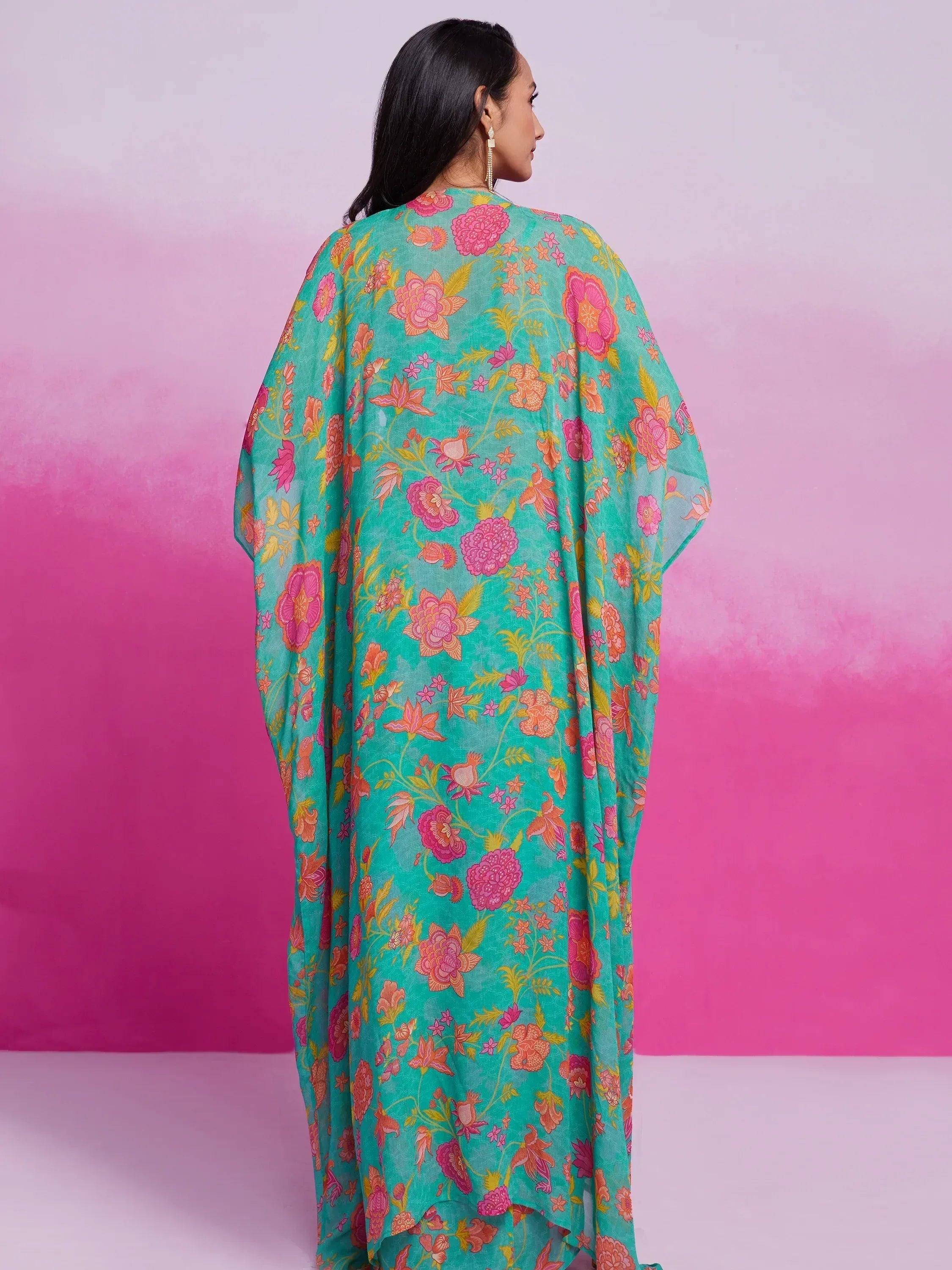 Teal floral print ethnic gown with pink and orange blooms, stylish Indian wear for women