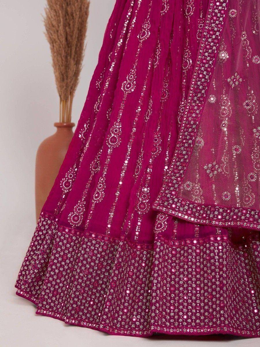 Fuchsia lehenga choli with silver mirror work and floral embroidery, perfect for Indian ethnic wear