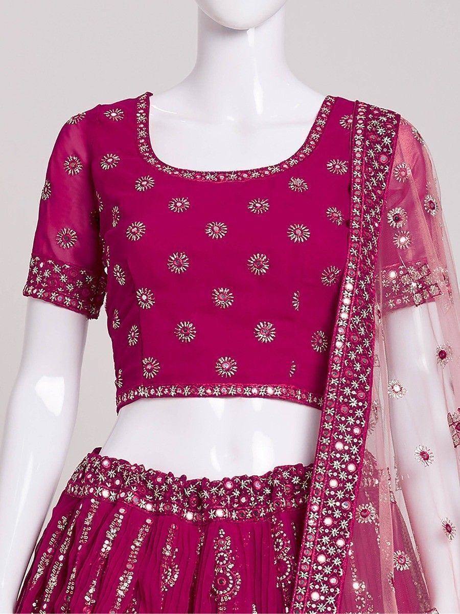 Fuchsia embroidered lehenga choli with floral motifs and sheer dupatta, ideal for Indian ethnic wear occasions