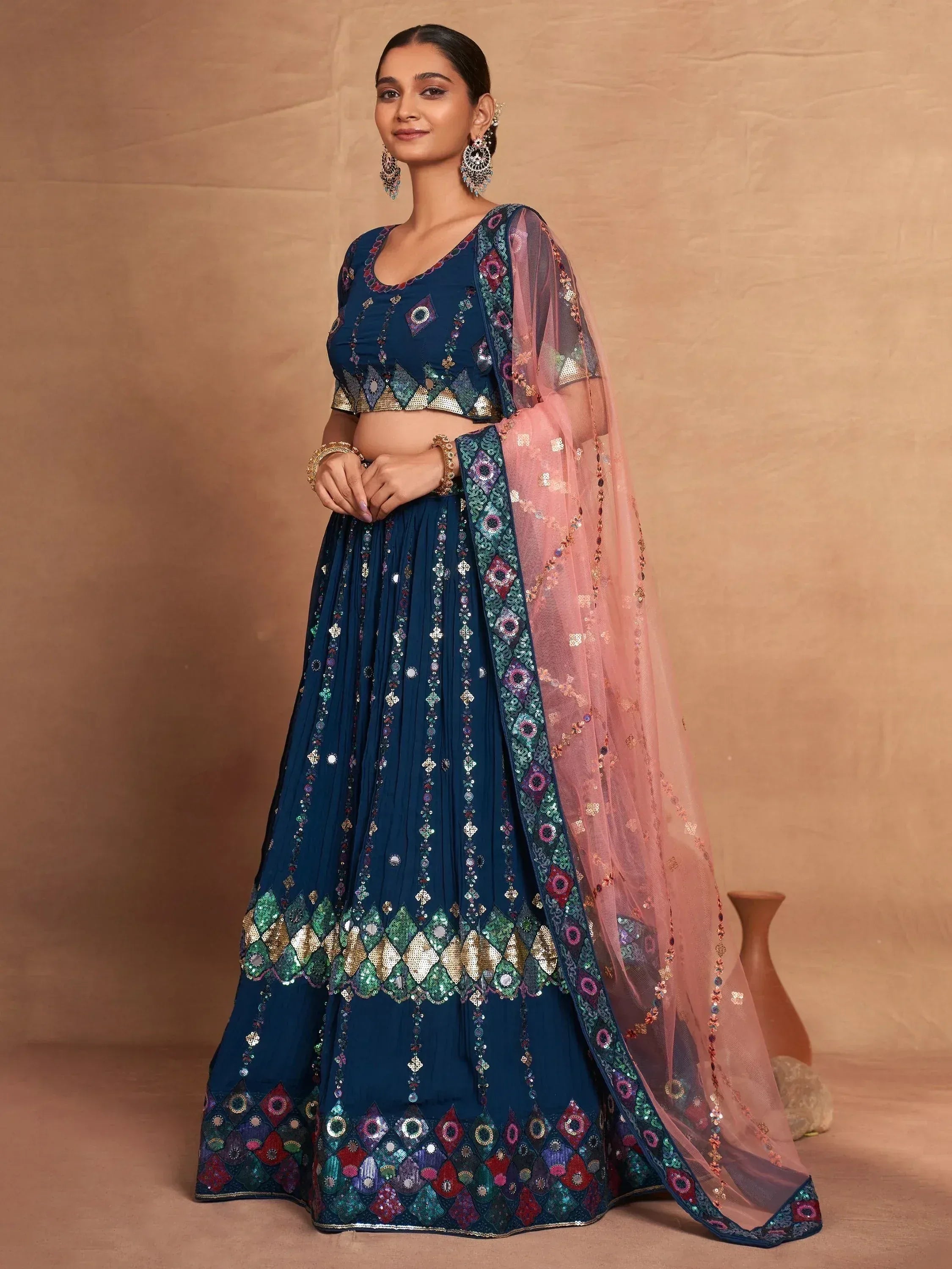 Elegant blue lehenga choli with intricate embroidery and pink dupatta for Indian ethnic wear