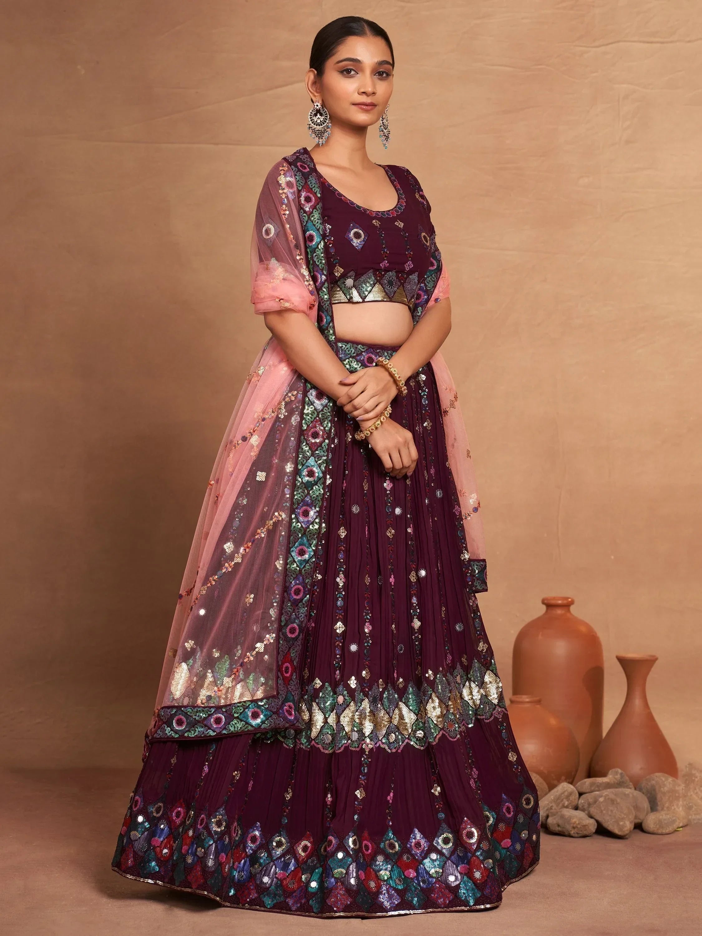 Elegant maroon lehenga choli with mirror work and pink dupatta, perfect for Indian ethnic occasions
