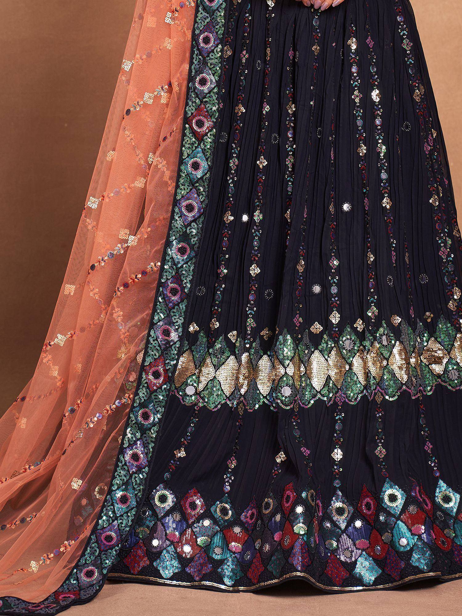 Black pleated lehenga with colorful mirror work and peach dupatta, ethnic Indian wear