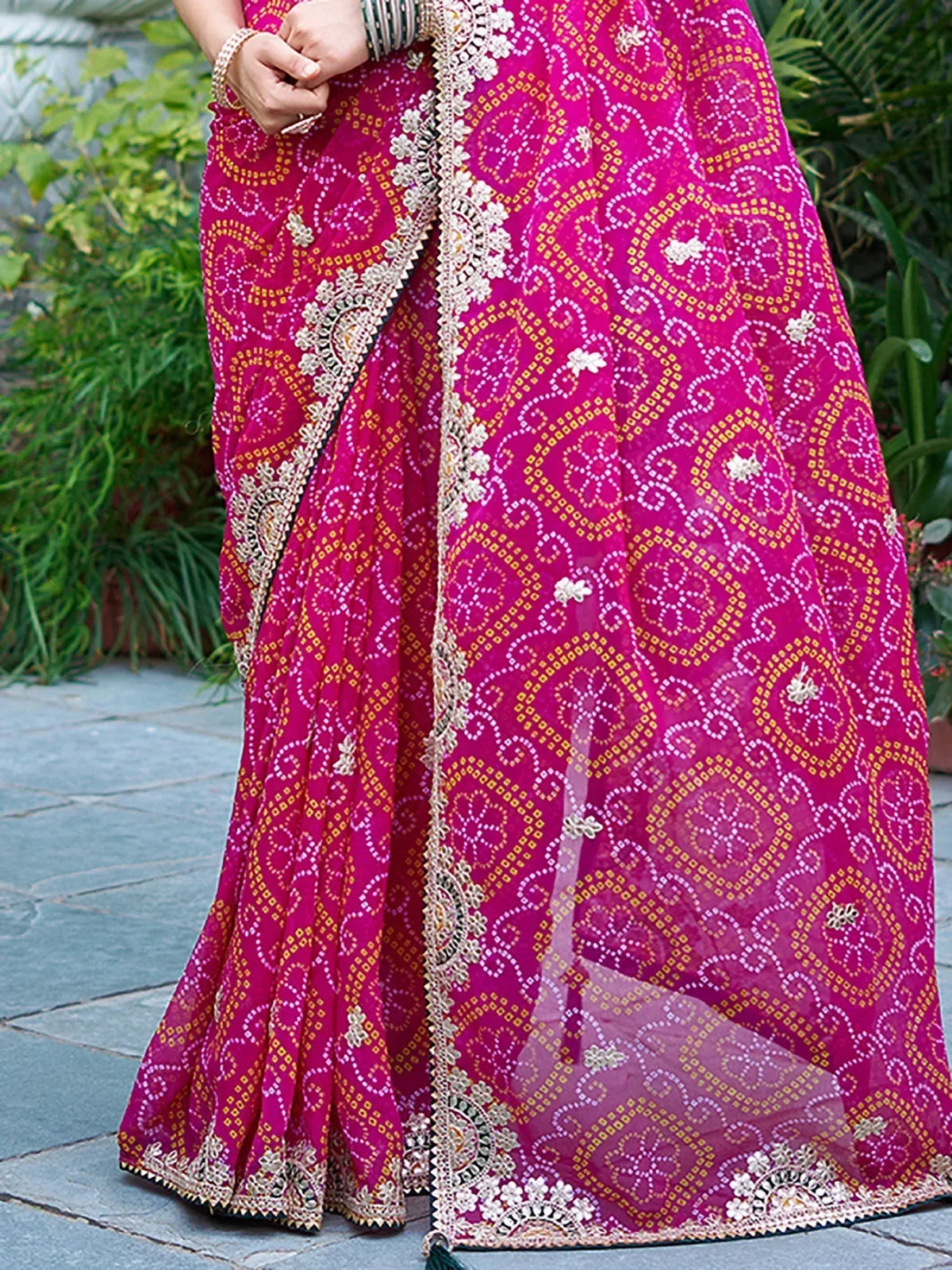 Pink ethnic lehenga choli with gold and white embroidery, floral border, and sheer dupatta for Indian wear
