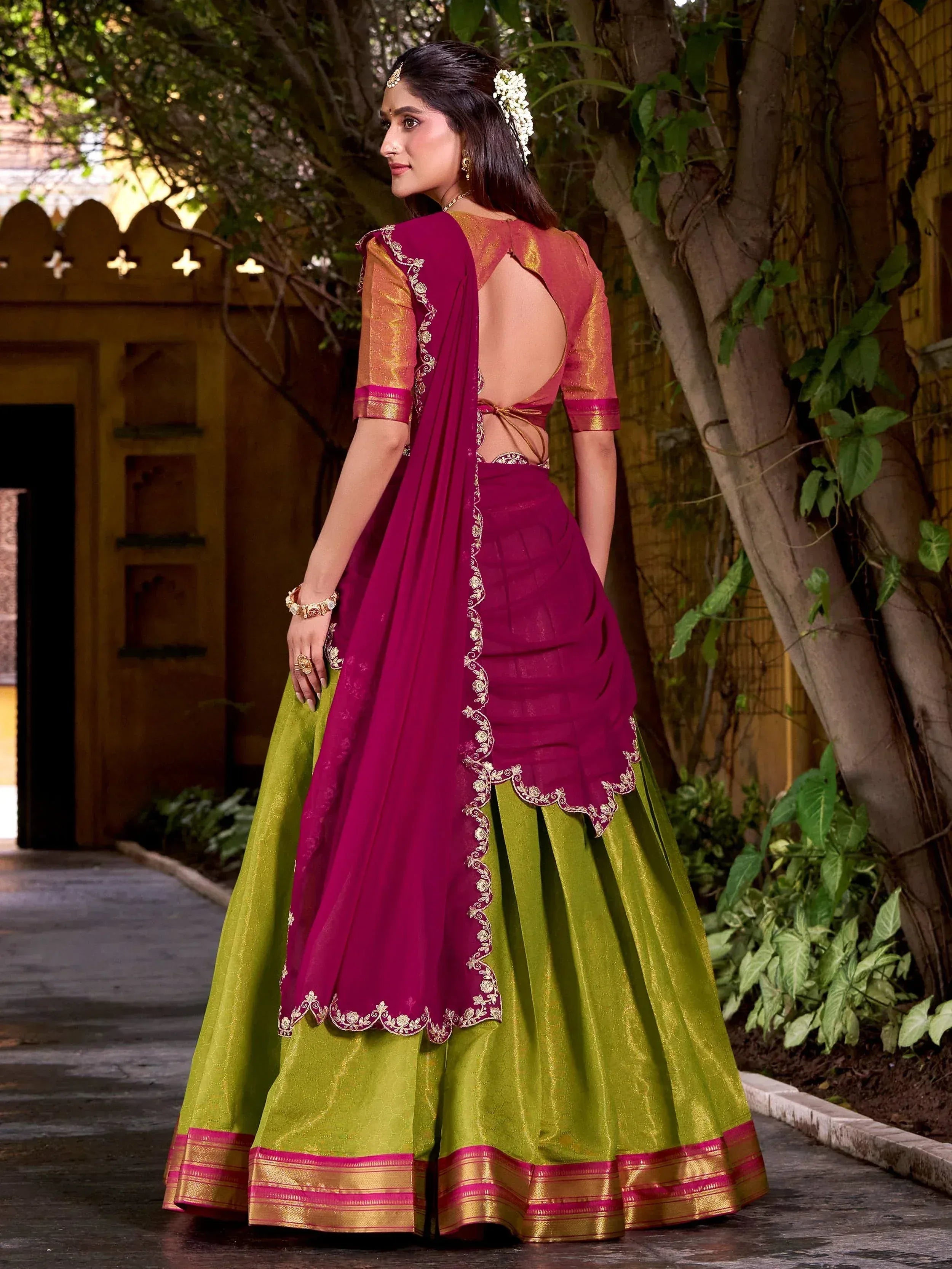 Elegant magenta and green lehenga choli with gold embroidery, backless blouse, perfect for Indian ethnic occasions