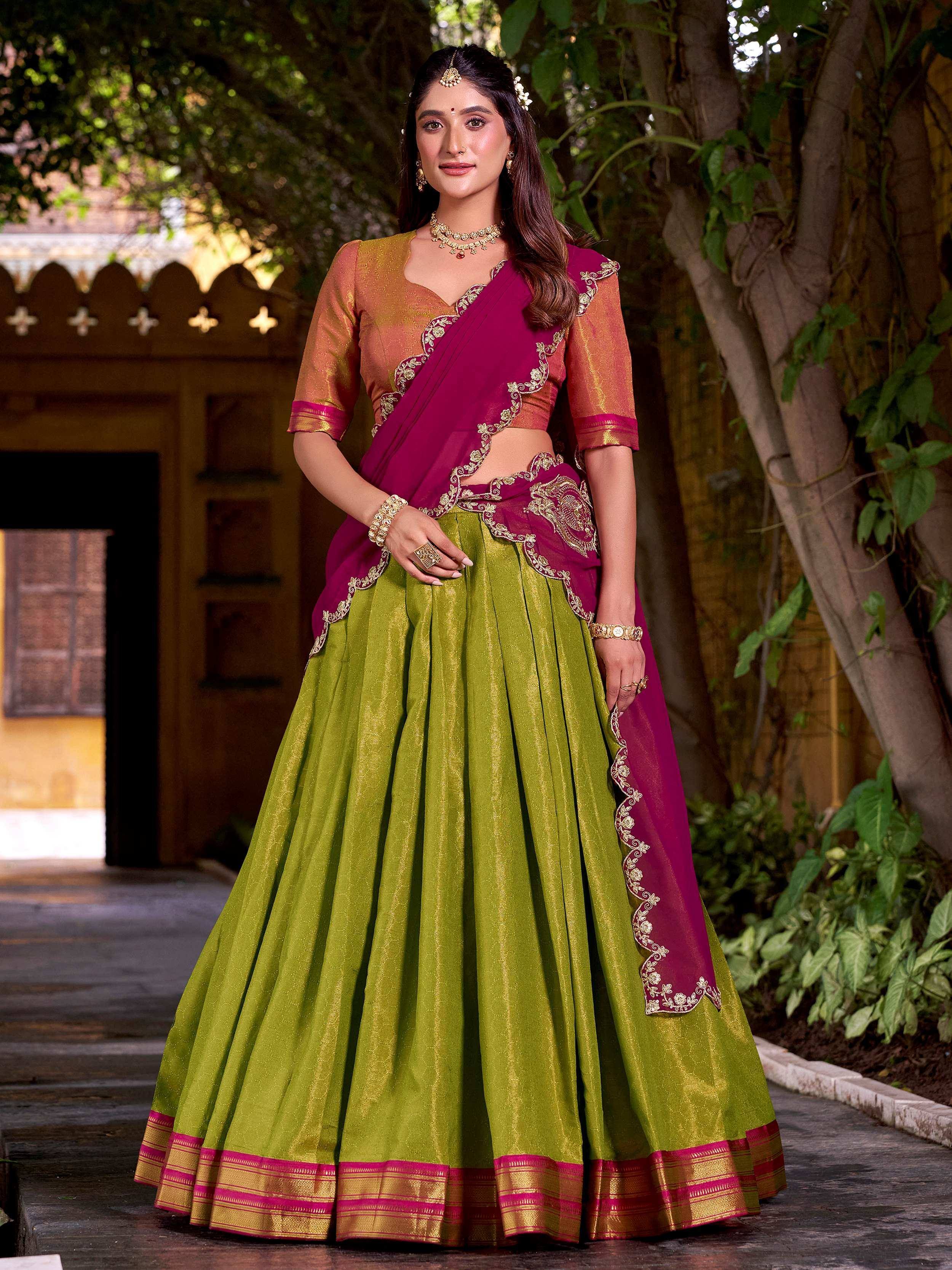 Green and maroon designer lehenga choli with gold embroidery, perfect for Indian ethnic wear occasions.