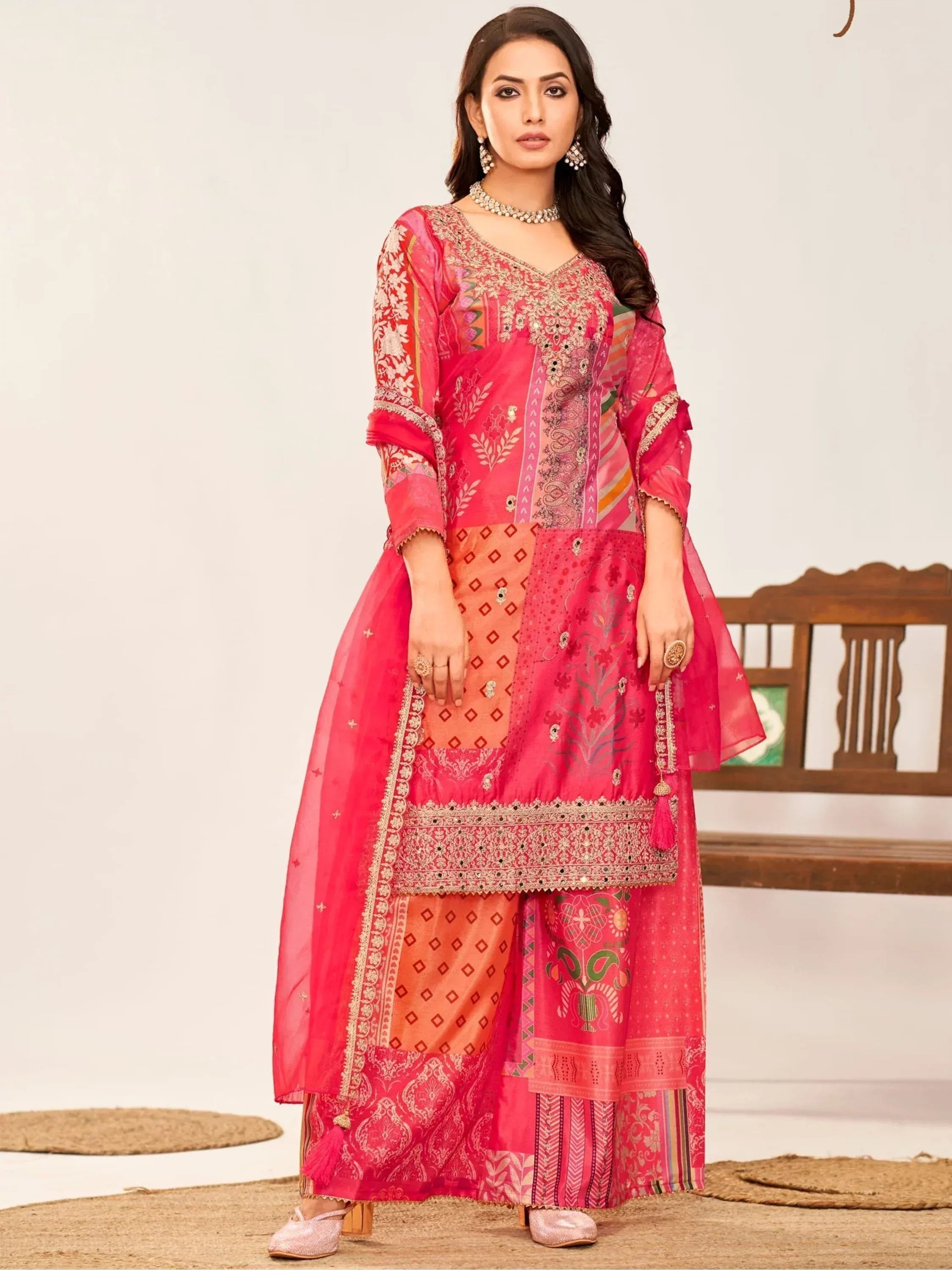 Pink embroidered ethnic salwar kameez with patchwork design, perfect for festive occasions