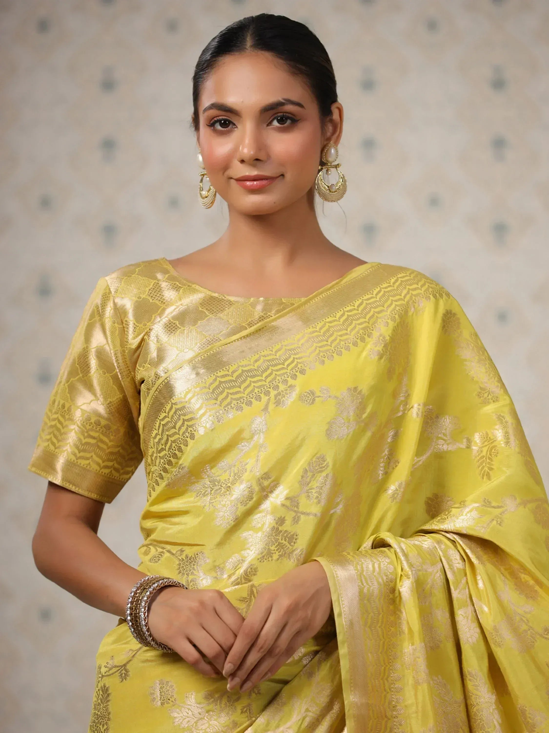 Yellow floral saree with gold embroidery, perfect for ethnic wear occasions