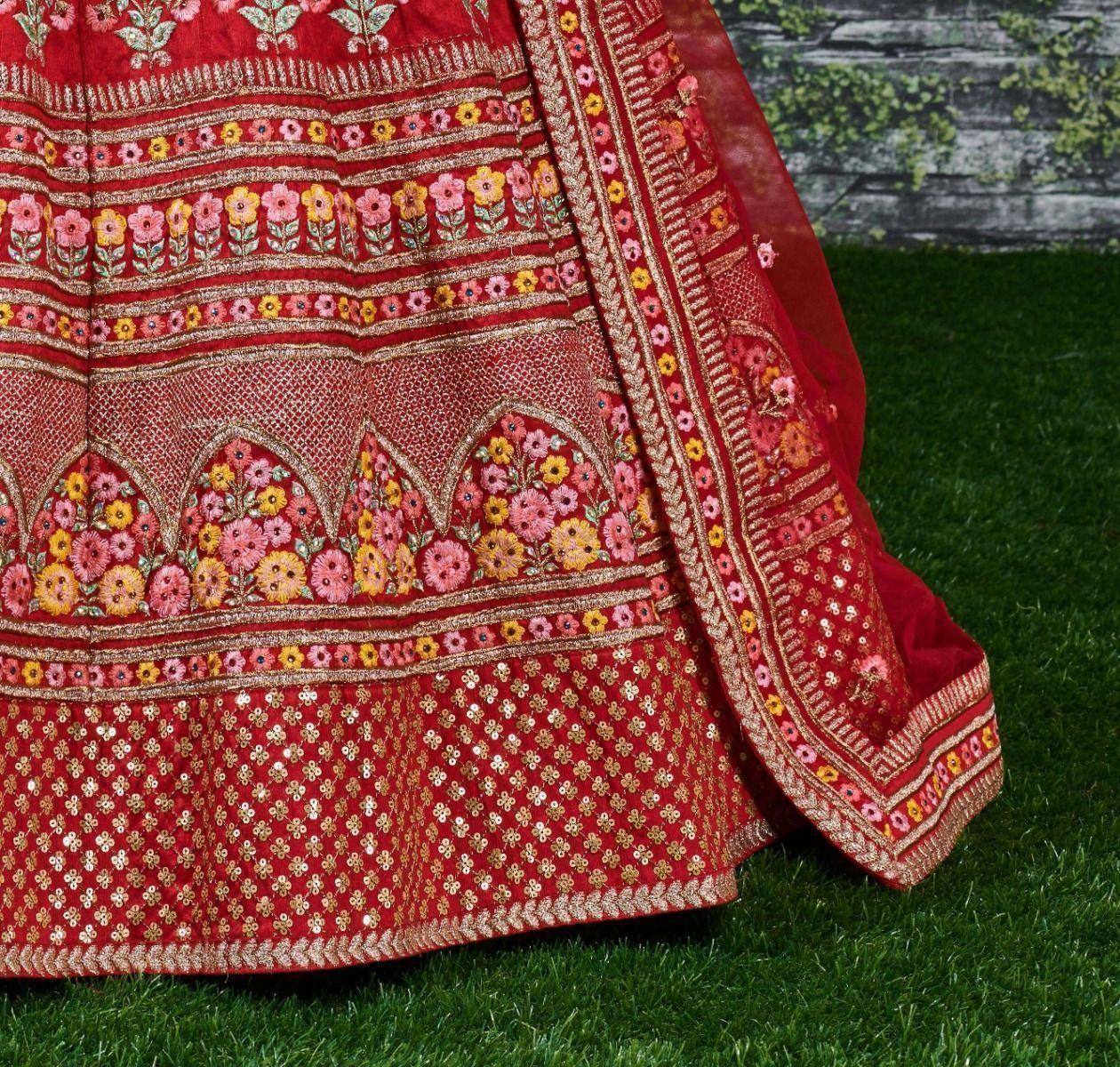 Red embroidered lehenga with floral patterns and gold detailing, perfect for Indian ethnic wear